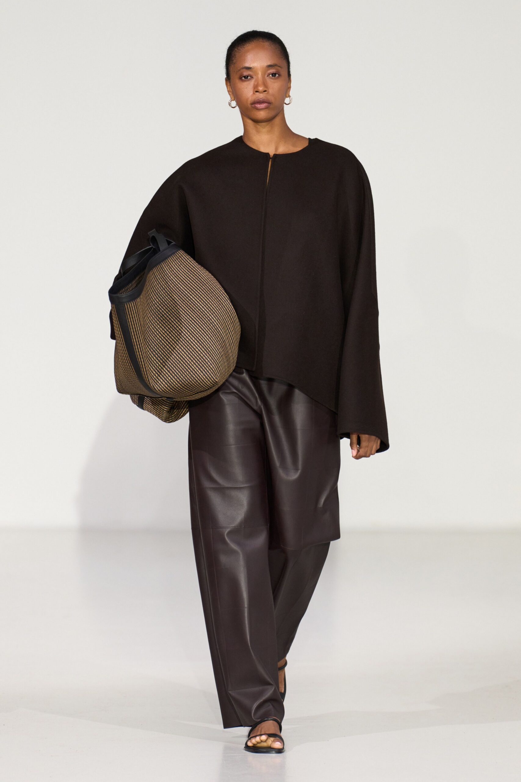 brown wool cape and leather pants