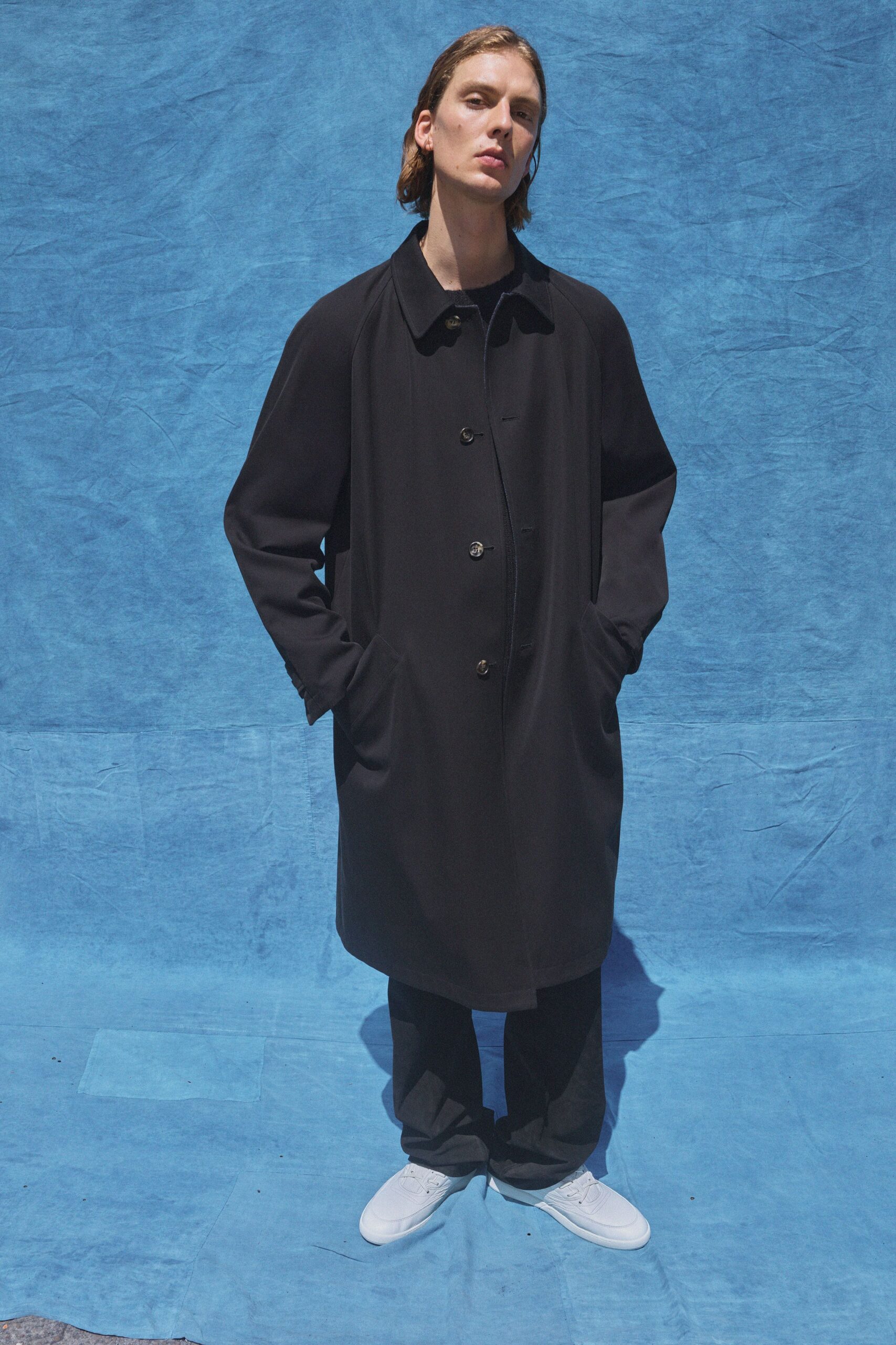 black wool coat with relaxed pants