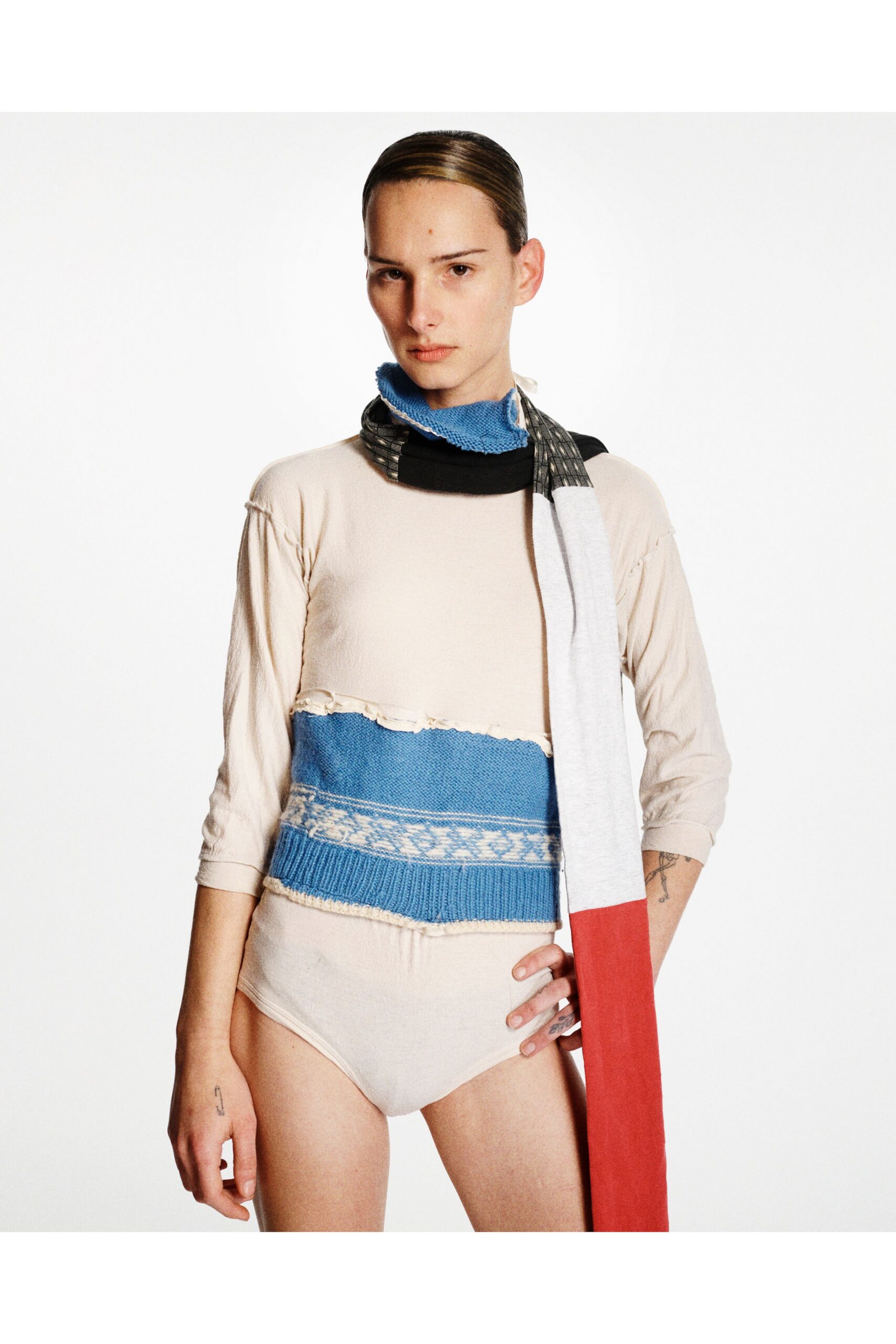 beige and blue fitted top with scarf