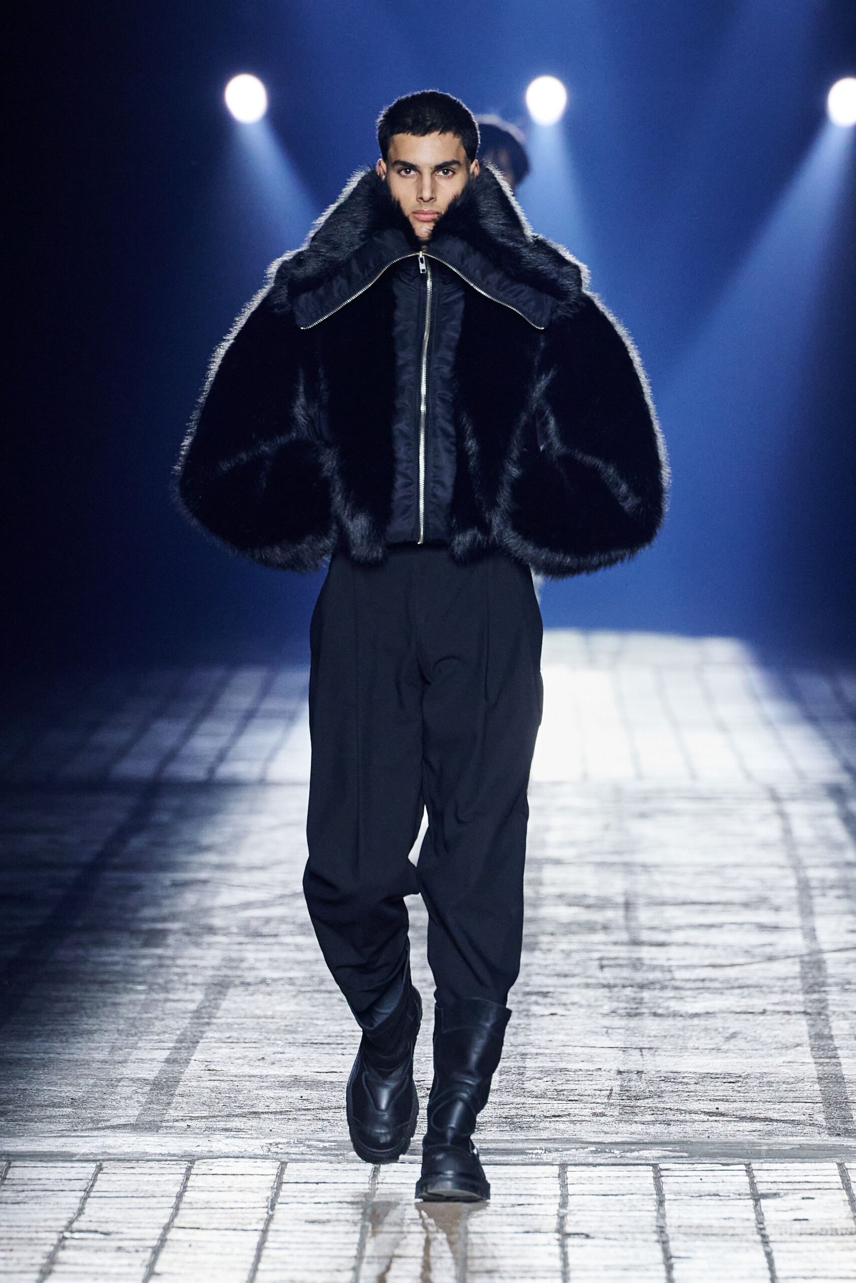 black faux-fur jacket with relaxed pants