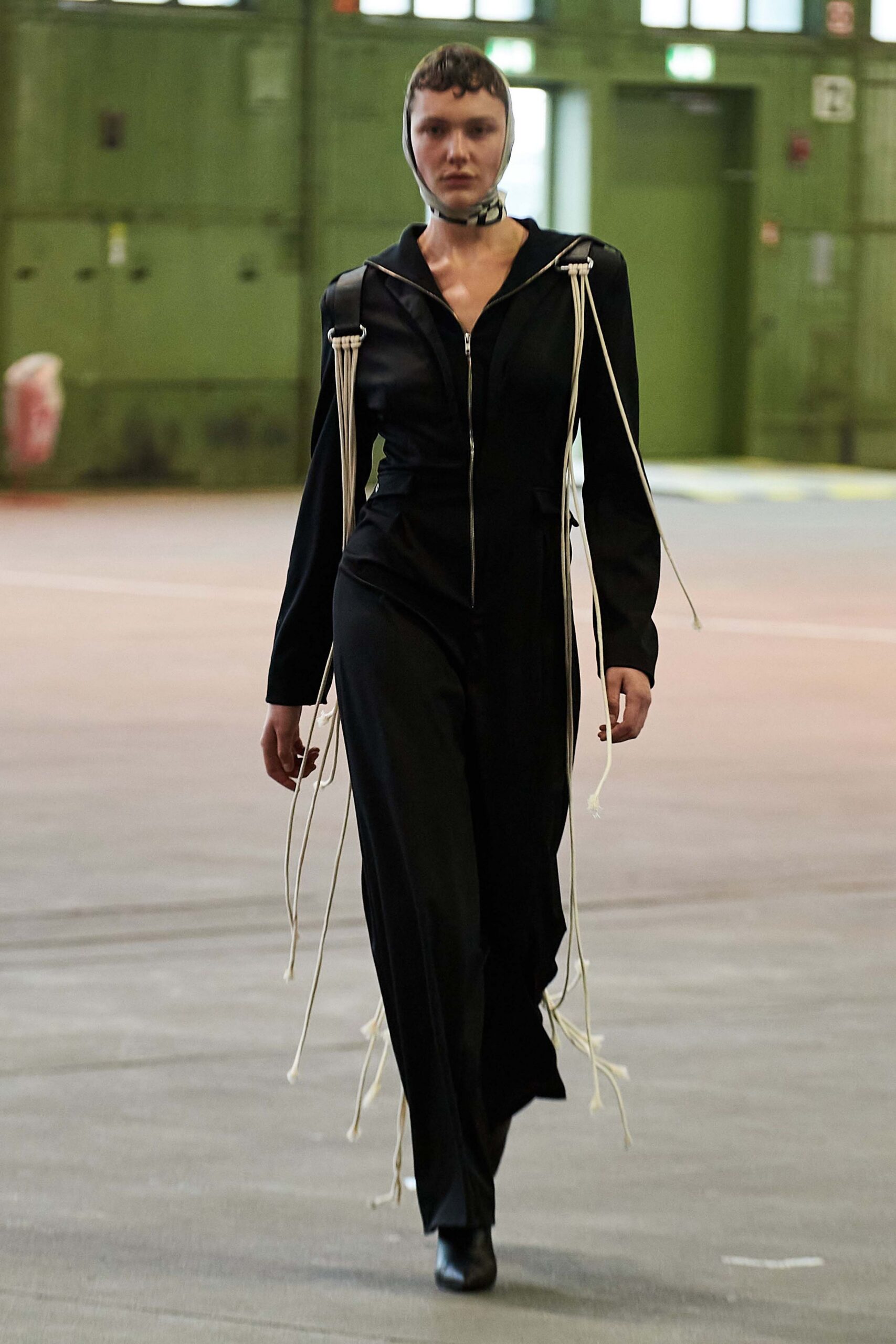black fitted jumpsuit with draped details