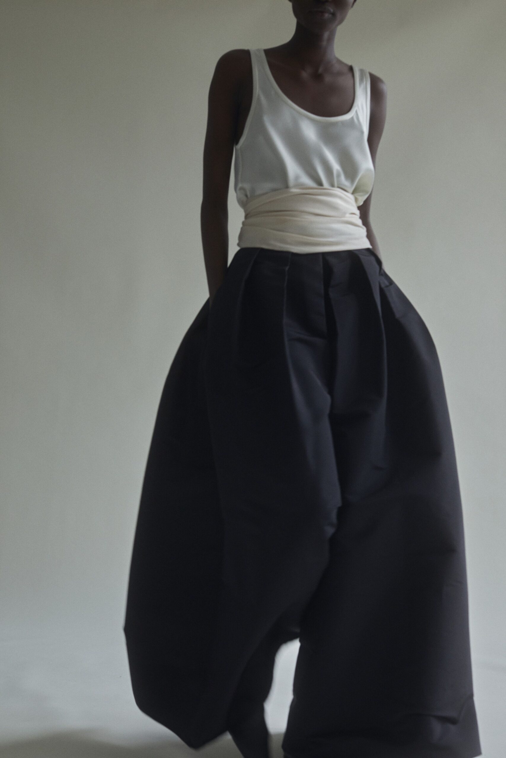 white tank-top and black wide-leg pants