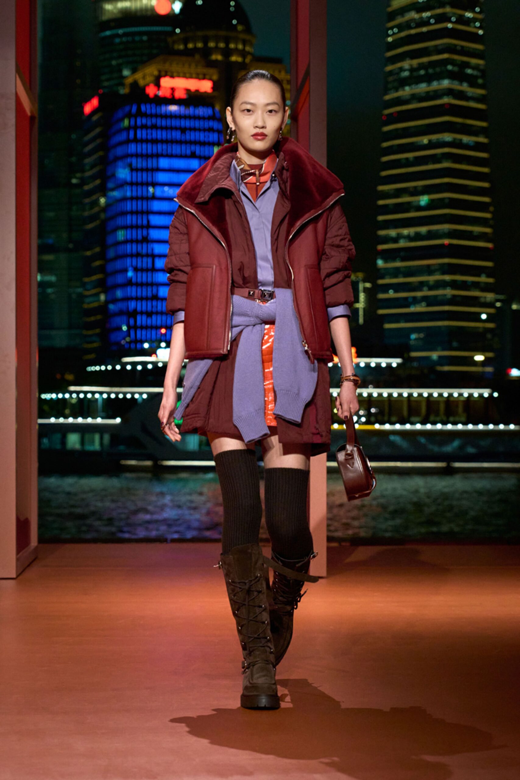 brown faux-fur jacket with purple shirt