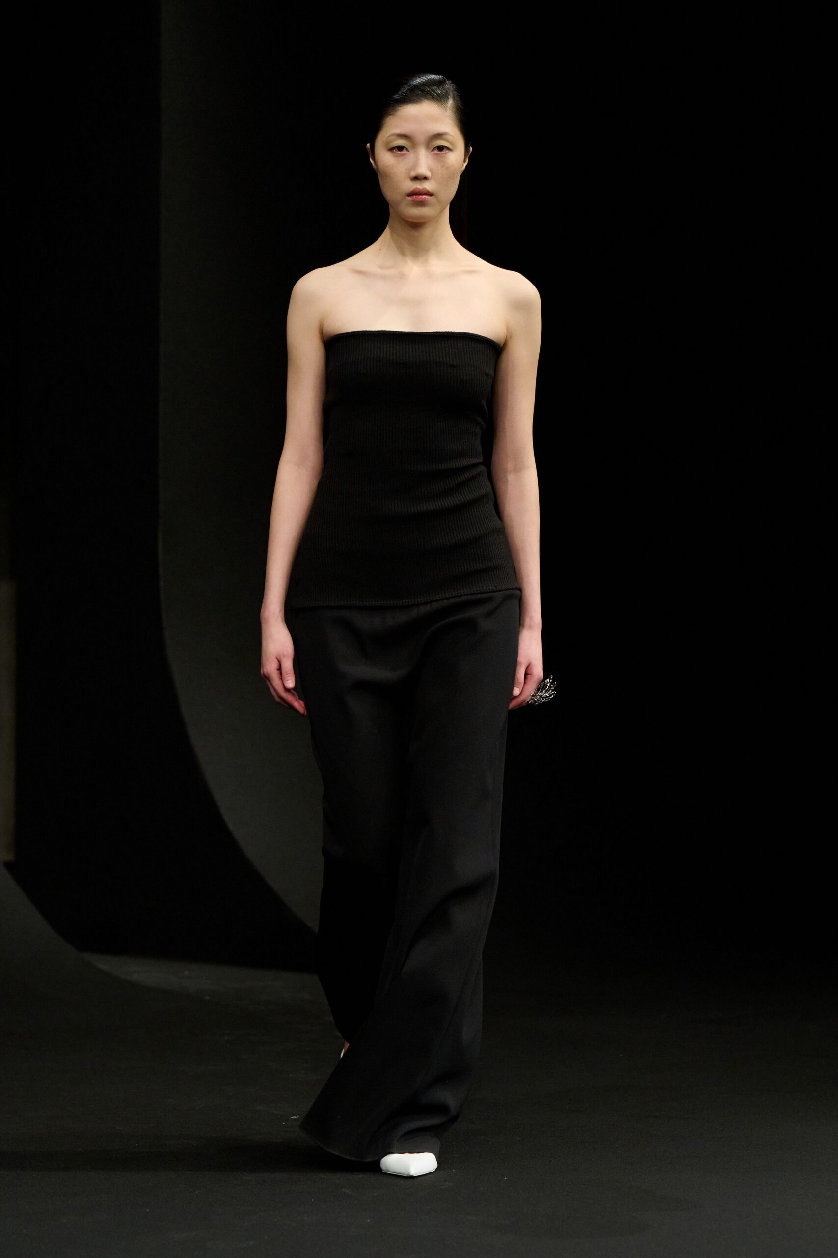 black fitted strapless top with relaxed pants