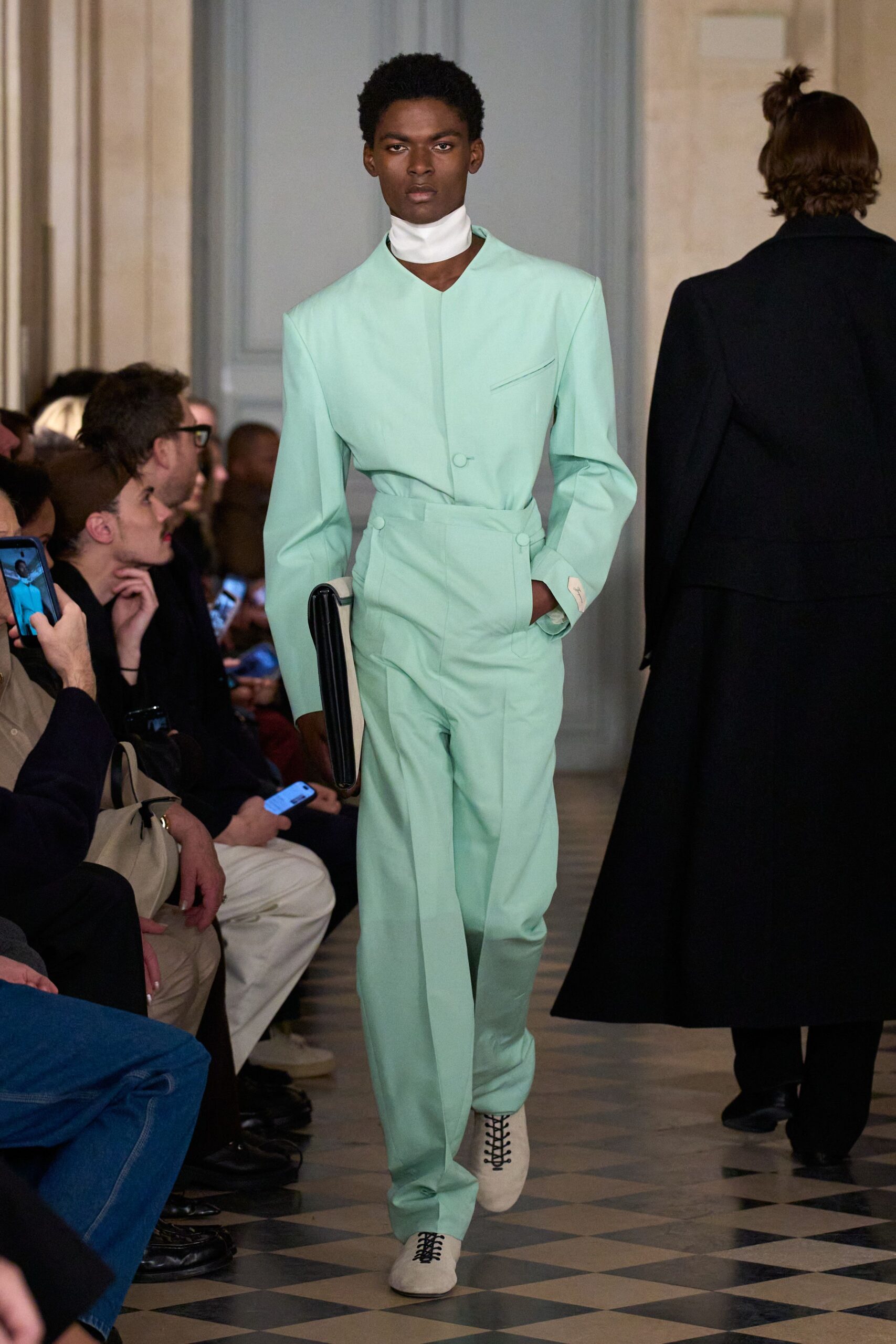 mint fitted suit with black bag