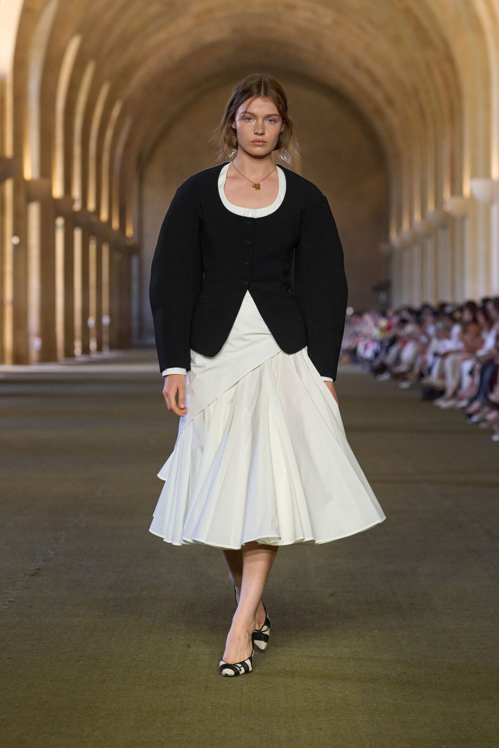 black jacket white top midi skirt