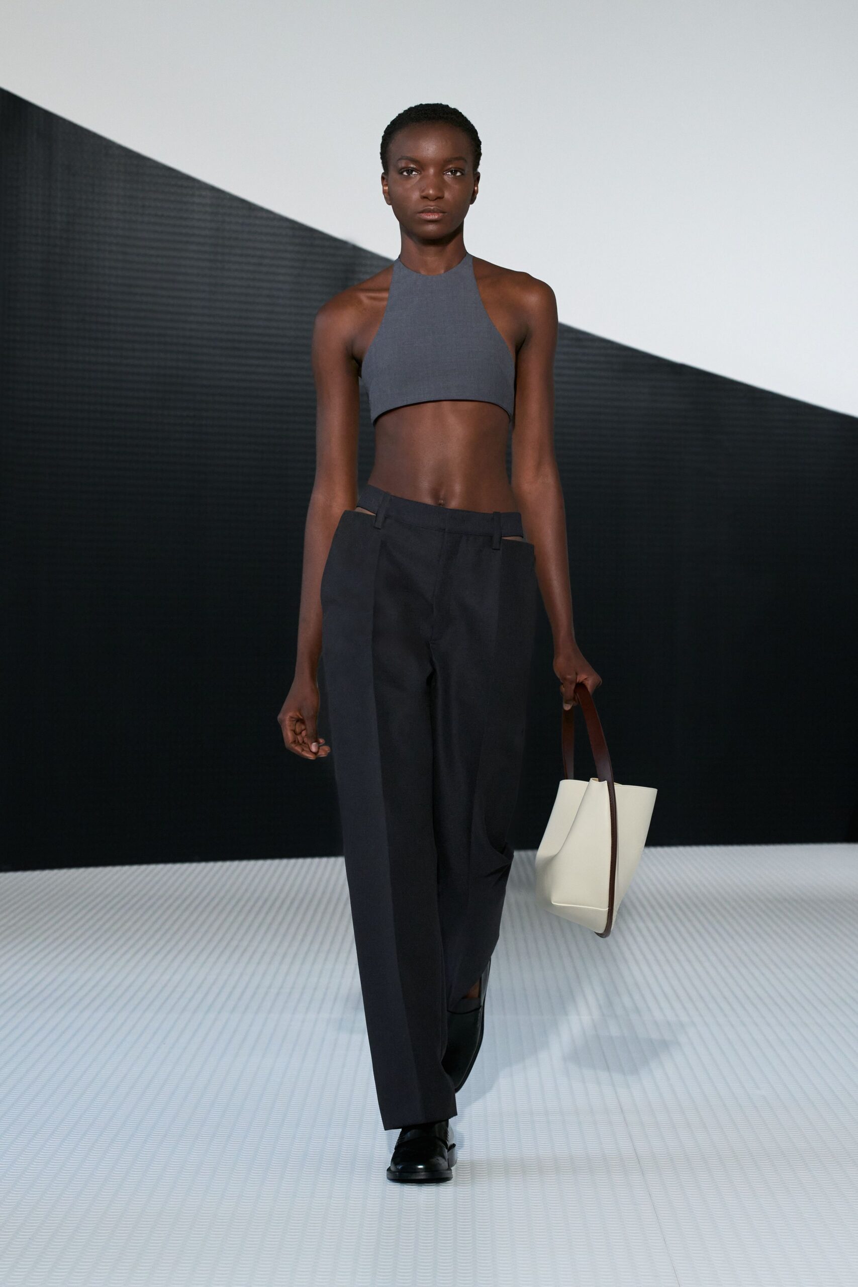 gray fitted halter top with black pants
