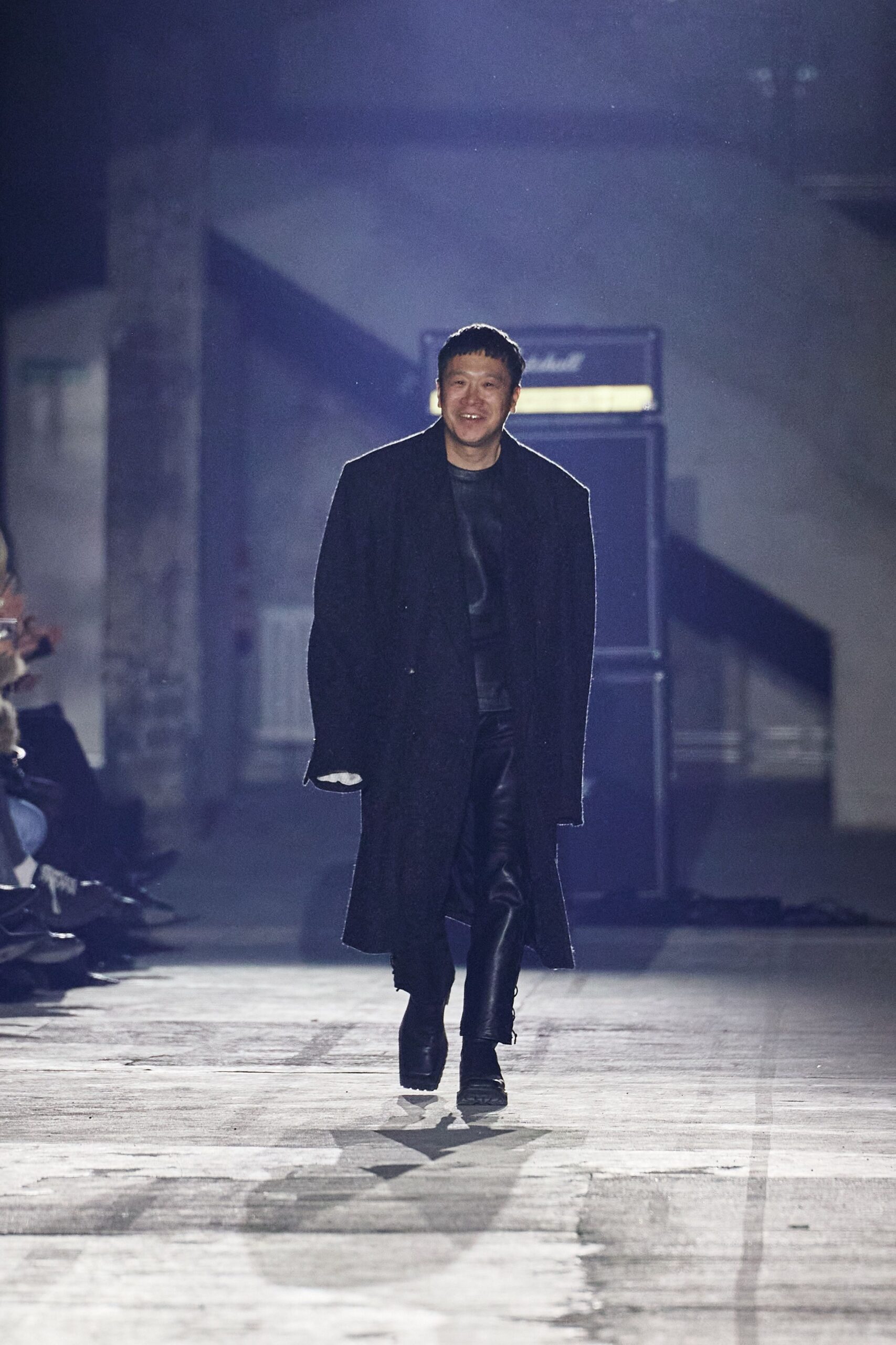 black wool coat and leather pants