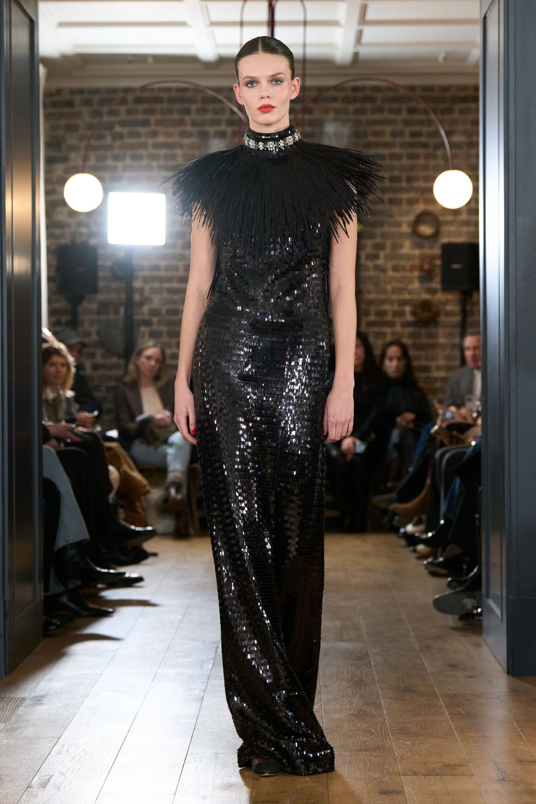 black sequined sleeveless gown