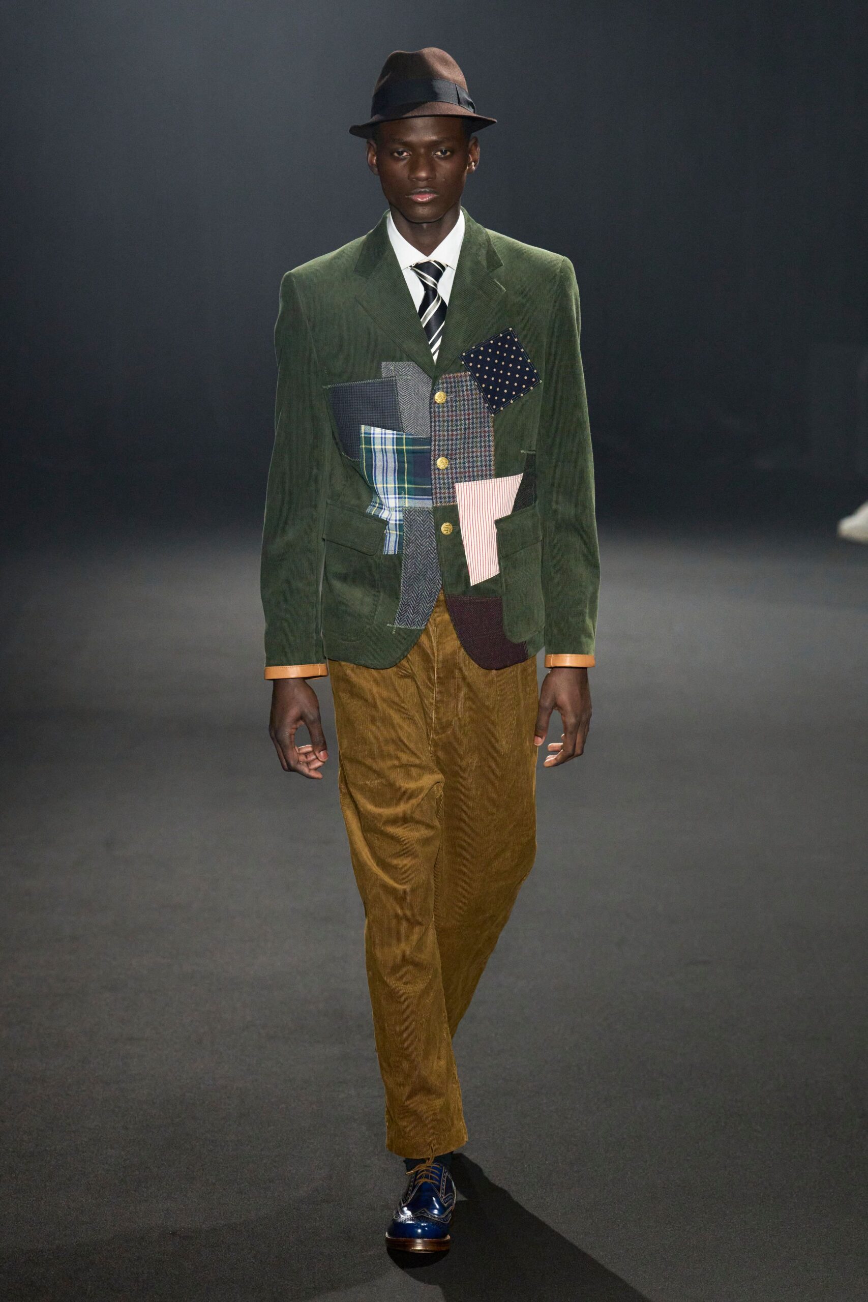 green patchwork blazer with brown pants