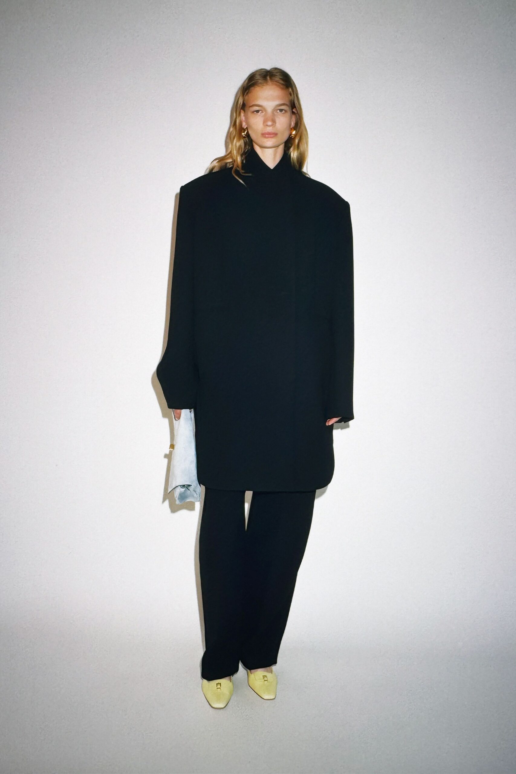 oversized black coat with relaxed pants