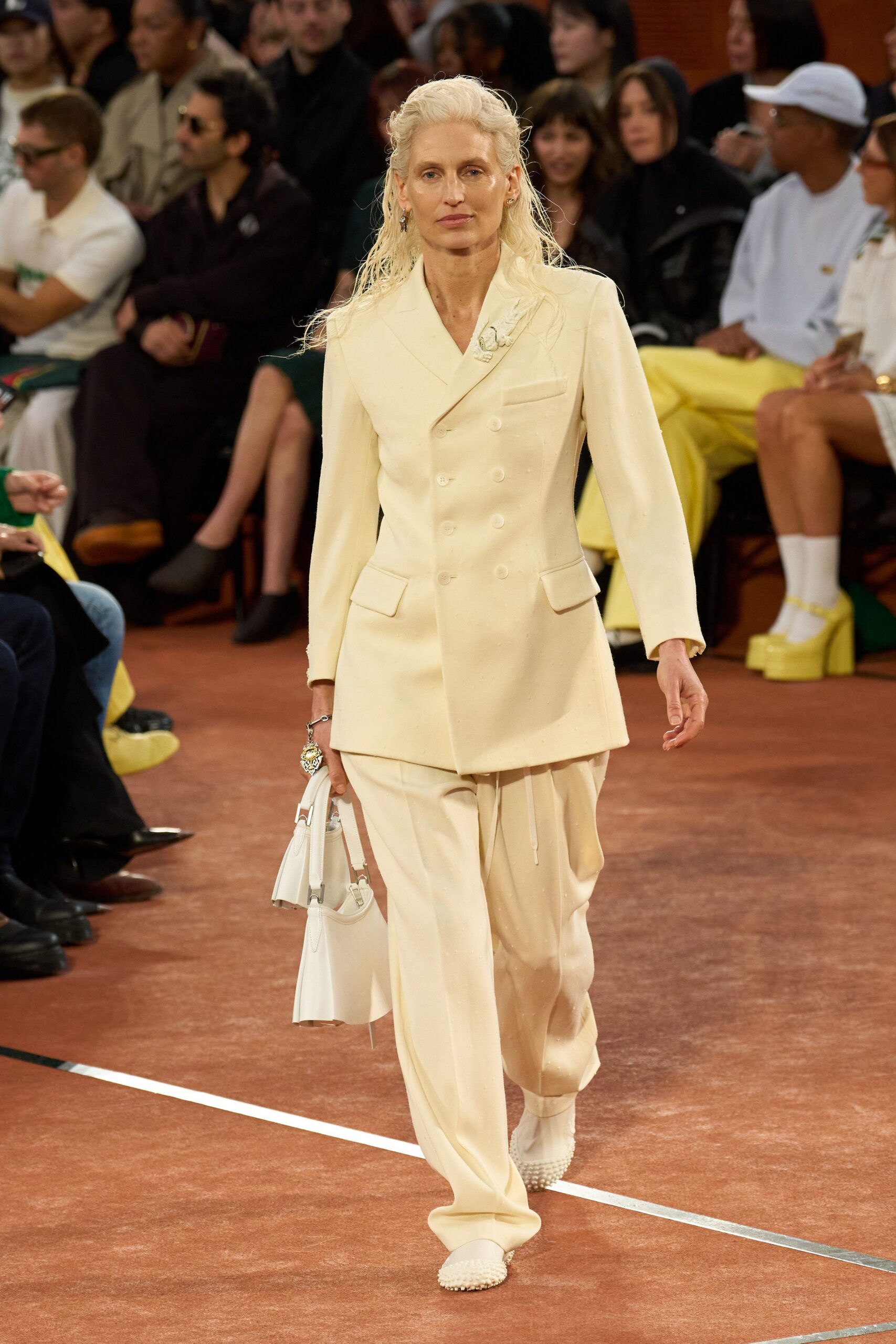 white tailored suit with bag