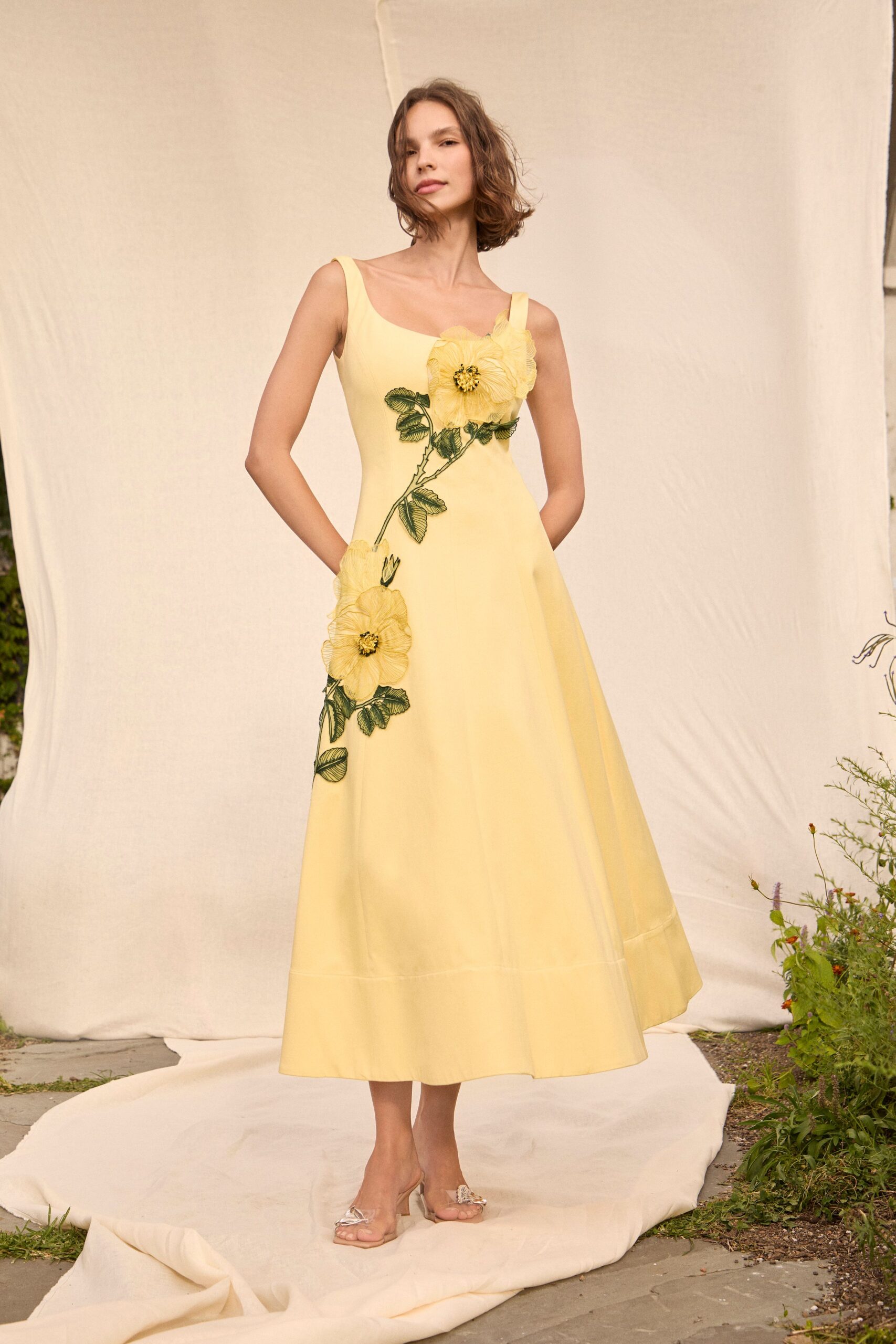 yellow floral midi dress with clear shoes