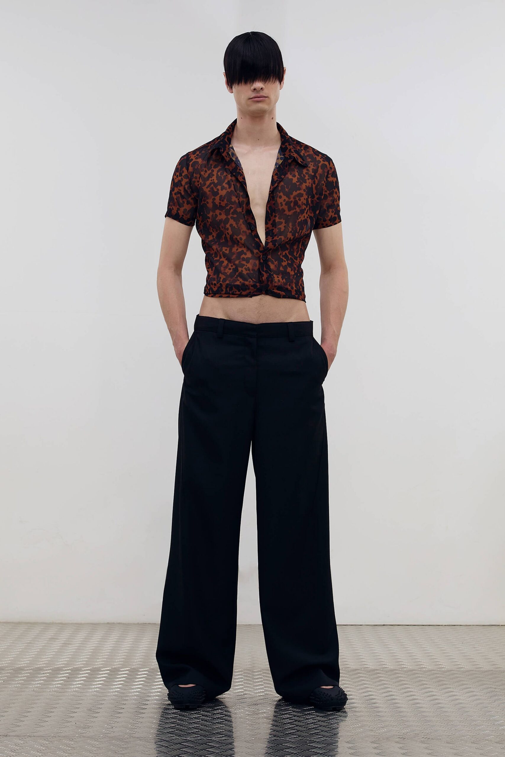 black wide-leg pants with animal-print shirt