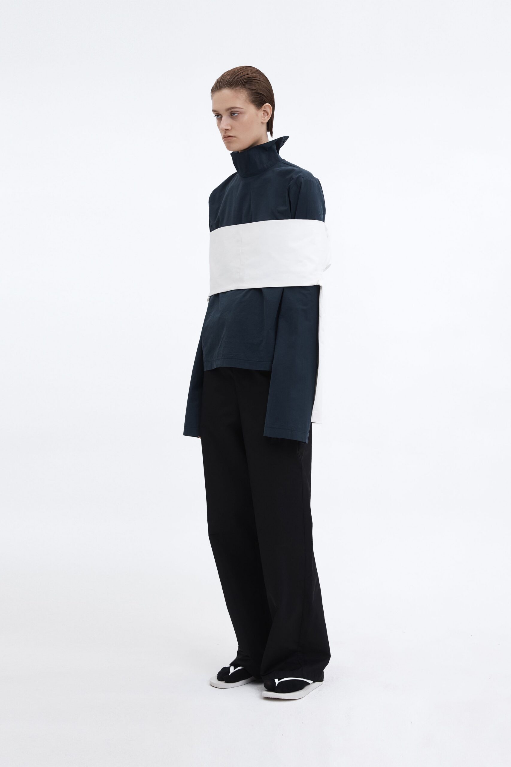 navy and white relaxed top with black pants