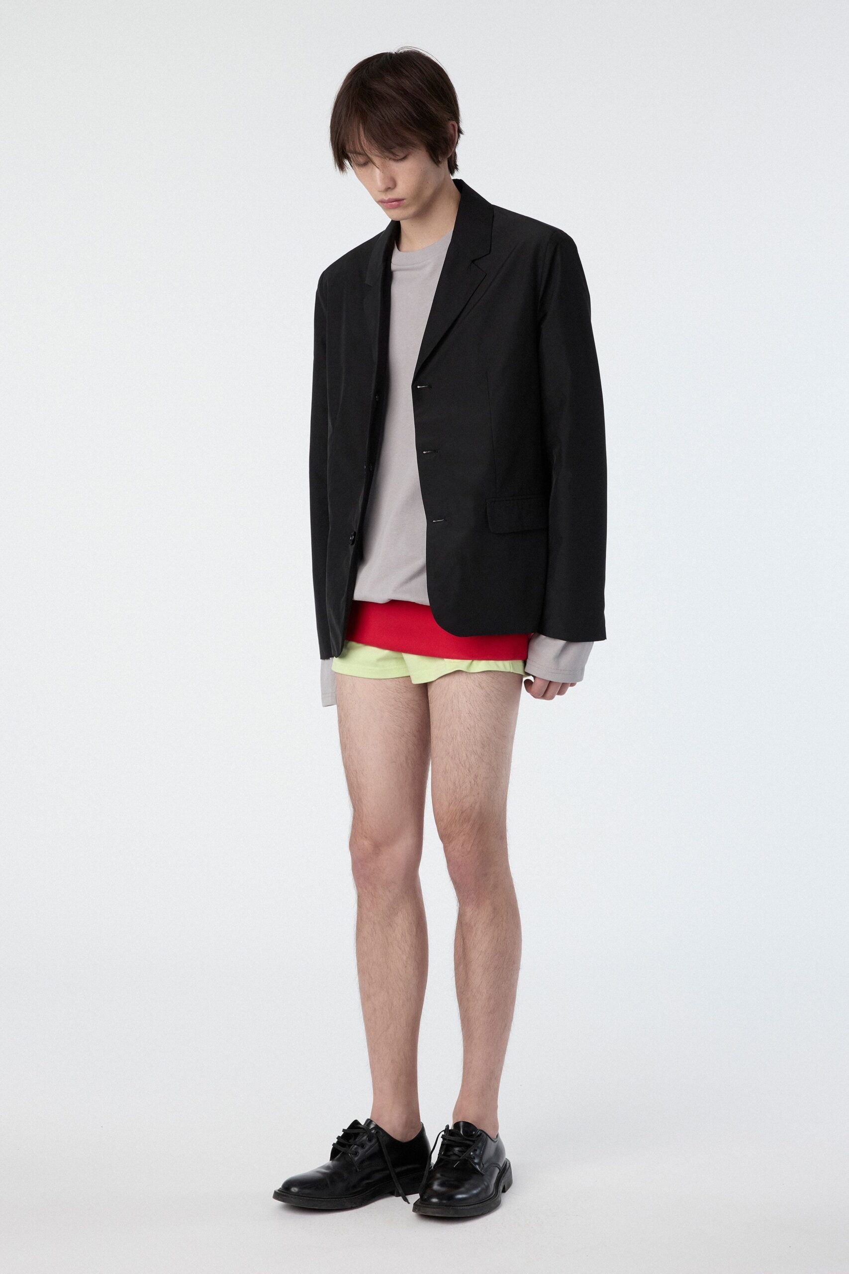 black blazer gray top red yellow shorts