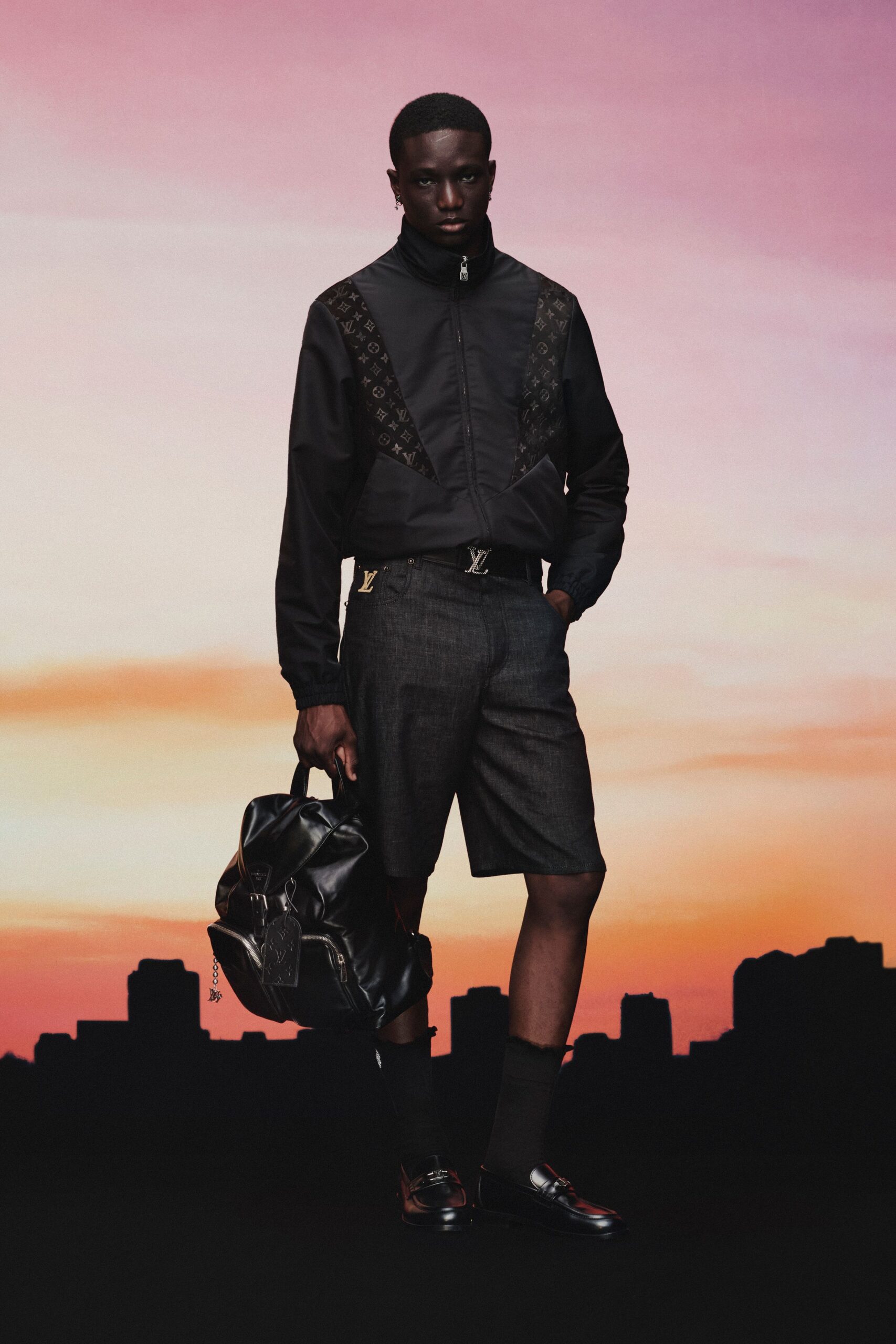 black fitted jacket with gray shorts