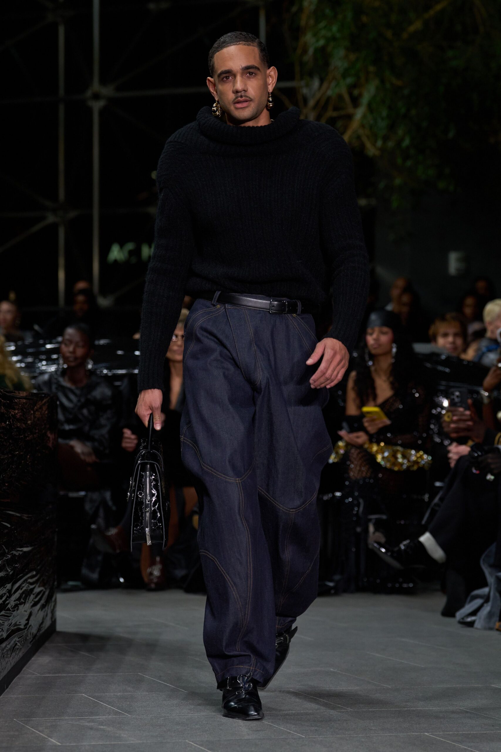 black wool sweater and blue denim pants