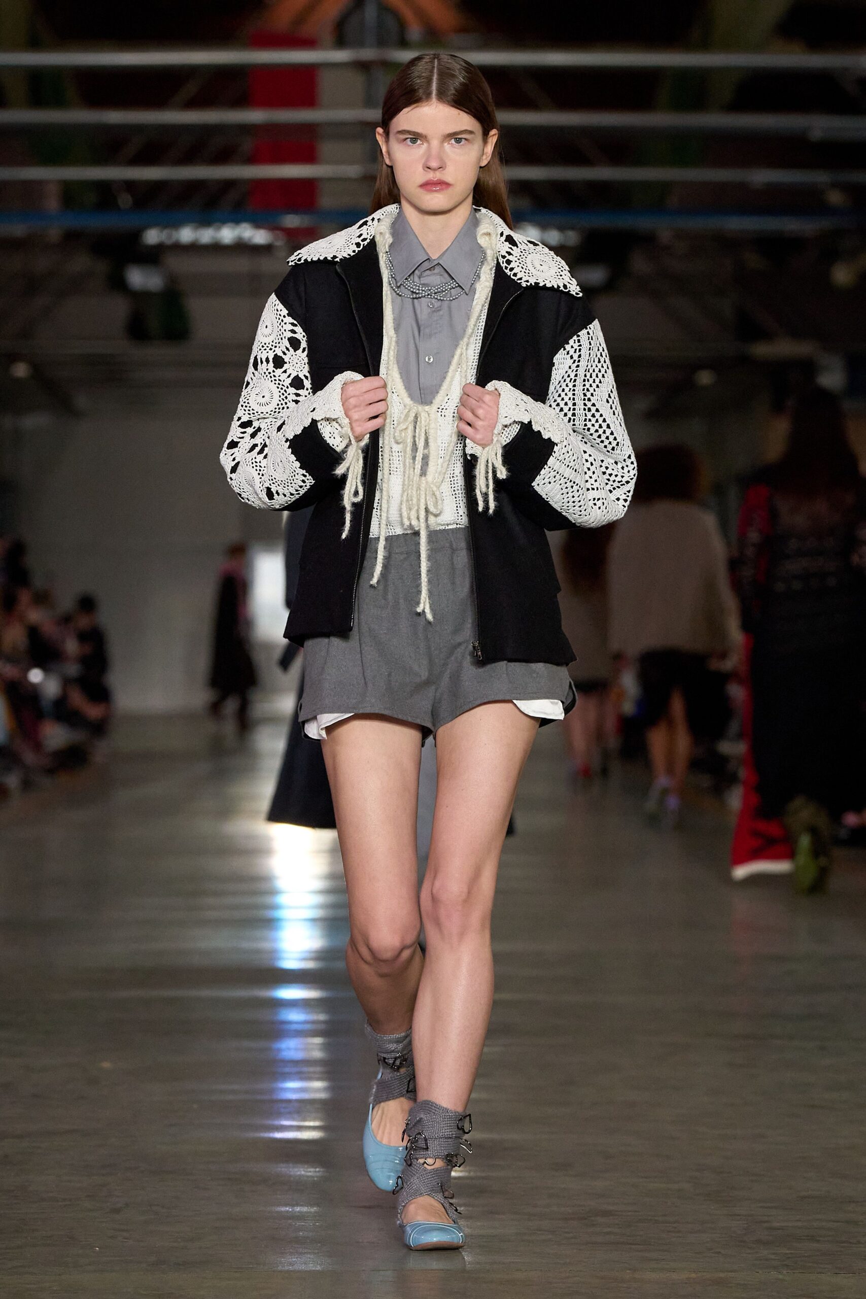 black embroidered jacket gray shirt shorts