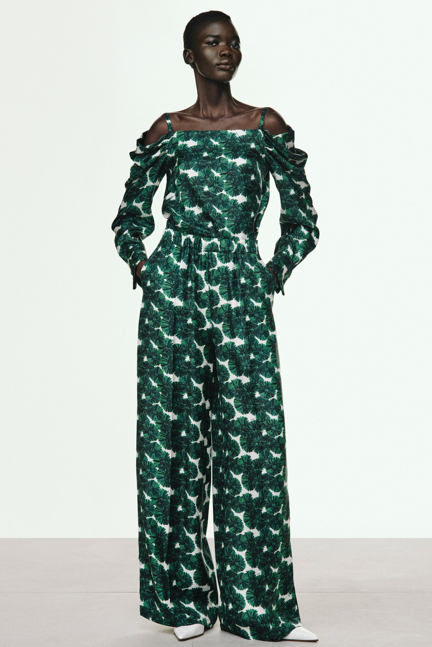 green cotton long-sleeve off-shoulder relaxed flared printed jumpsuit