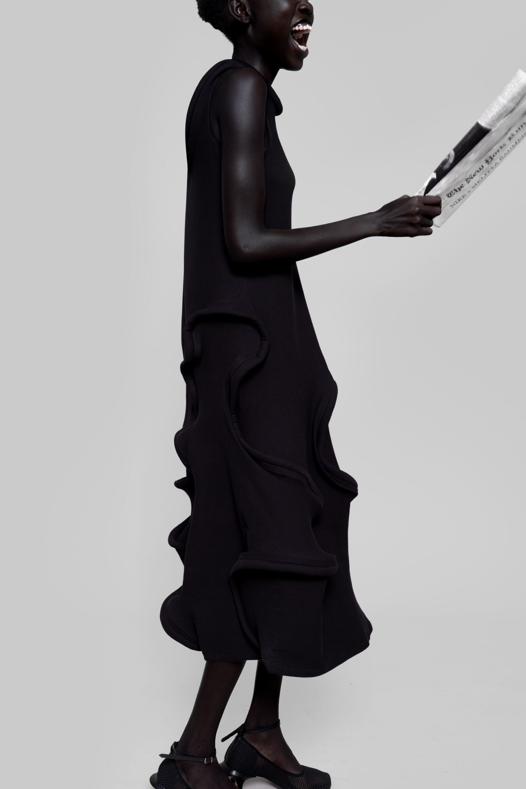 black relaxed midi dress with textured shoes