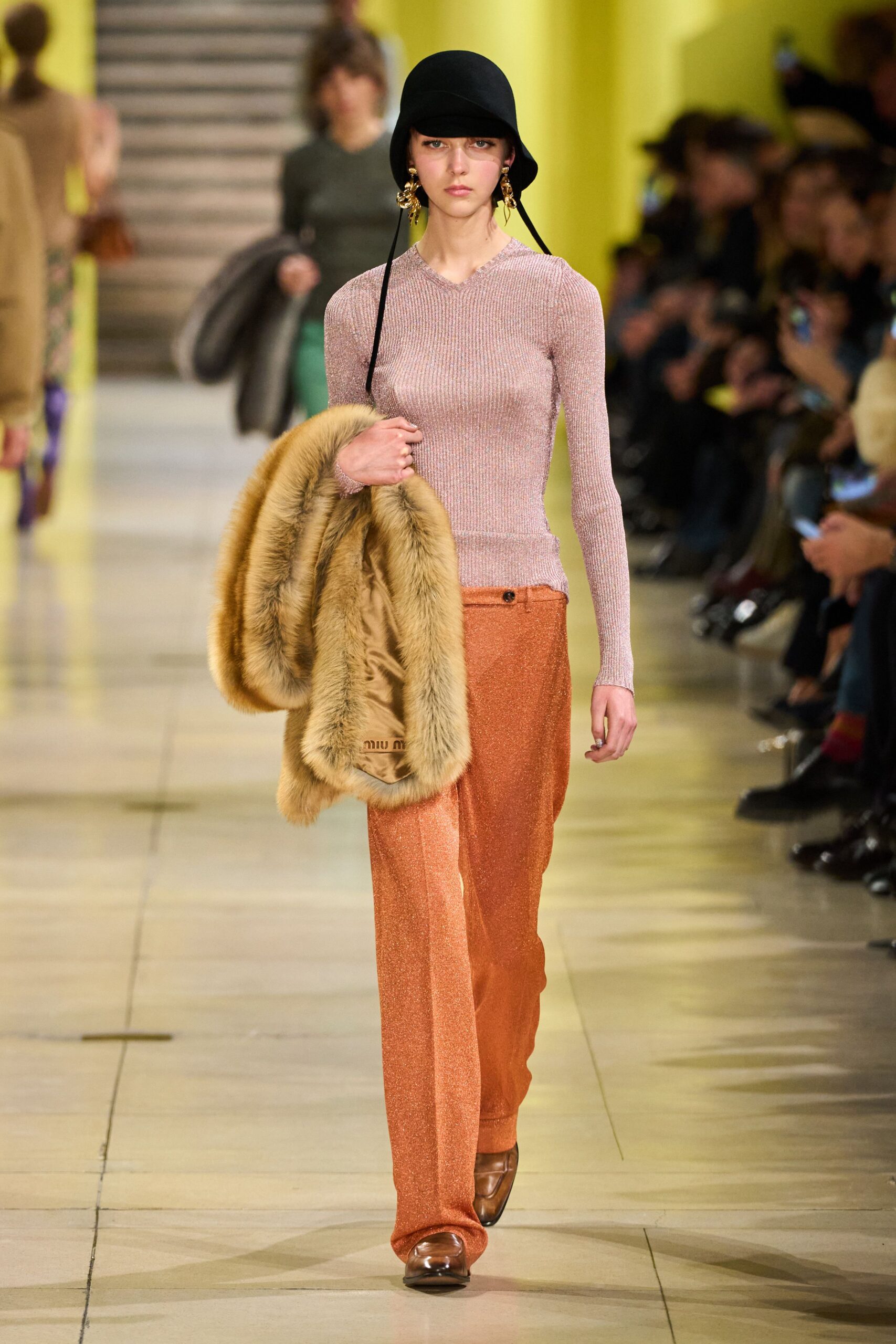 pink fitted top with orange pants