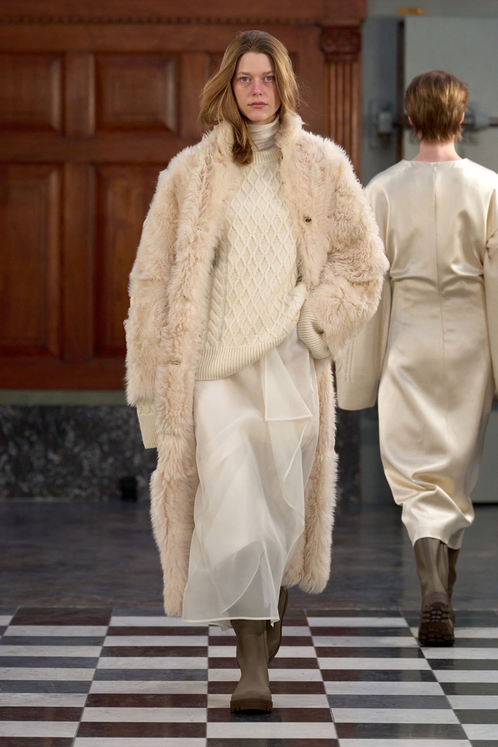 beige faux-fur coat with cream sweater