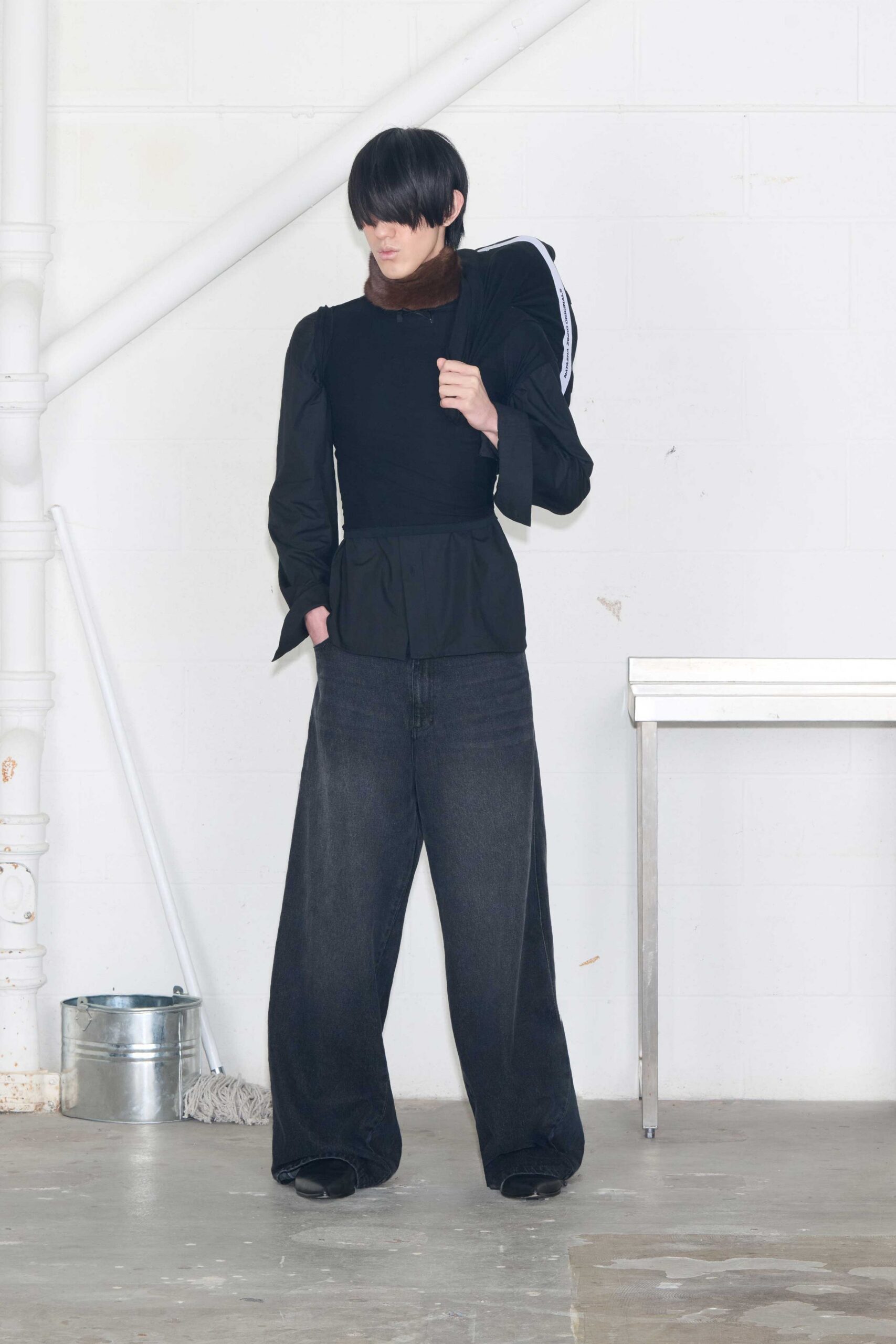 black fitted top with relaxed denim pants