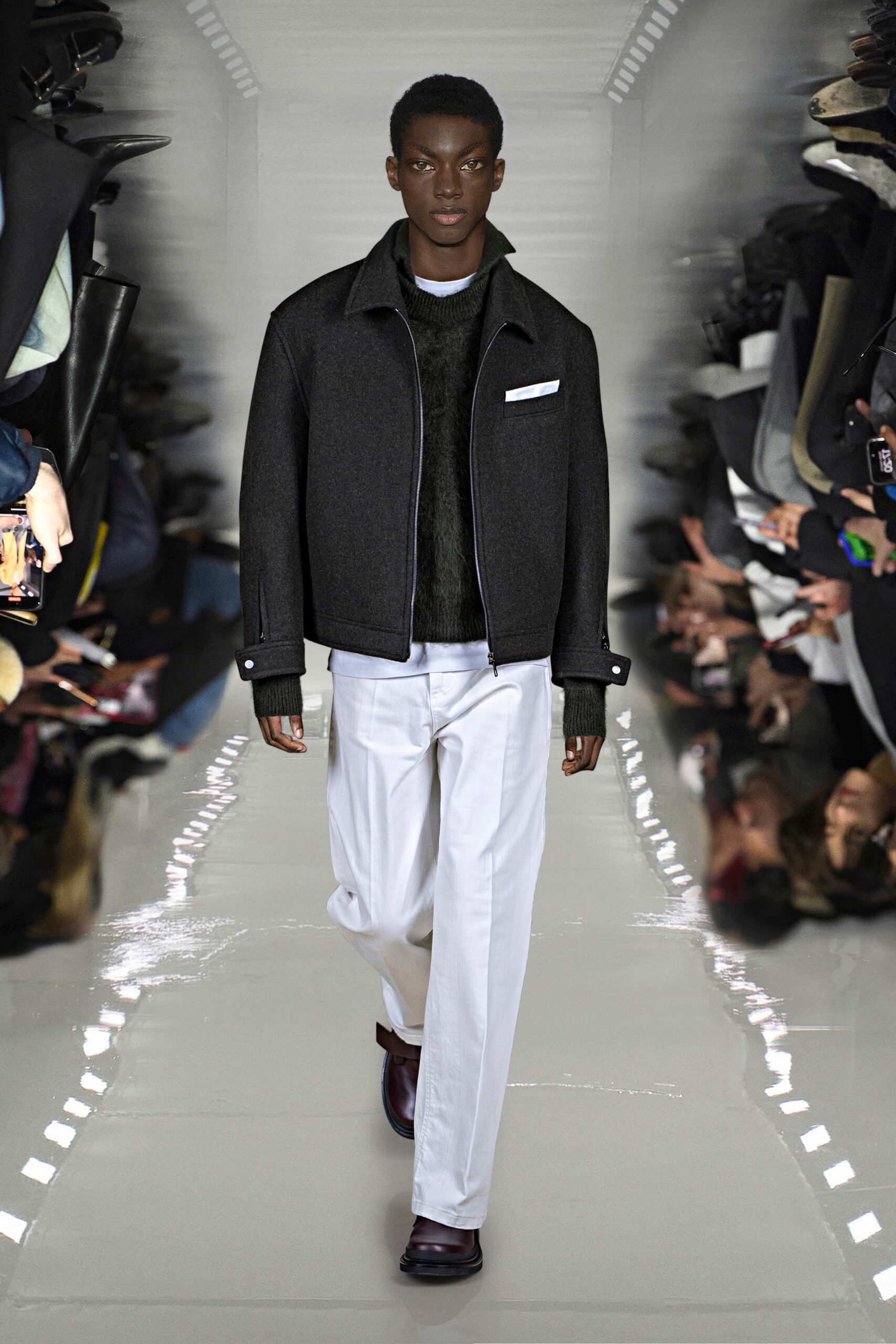 black wool jacket and sweater with white pants