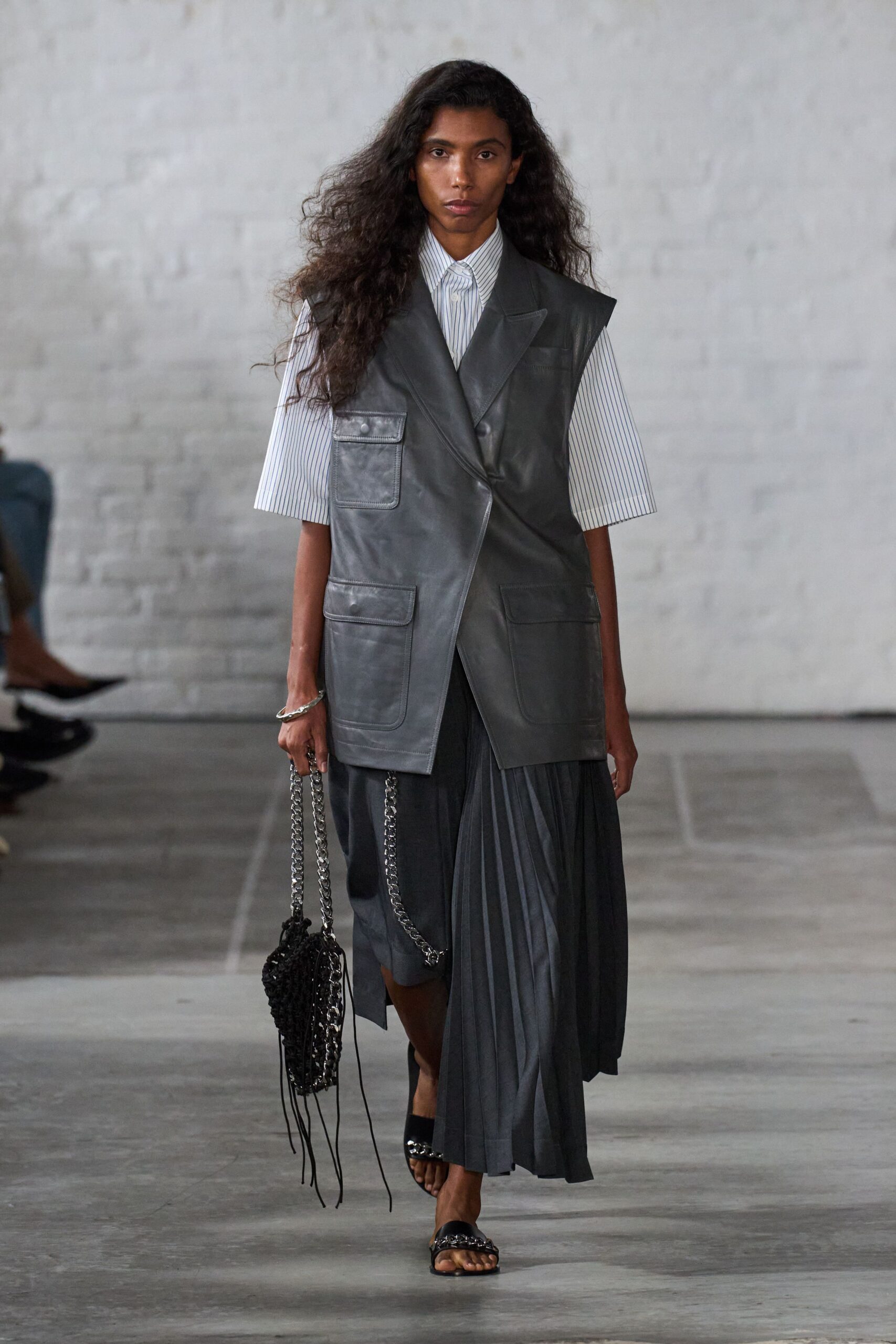gray leather sleeveless collared relaxed pockets vest