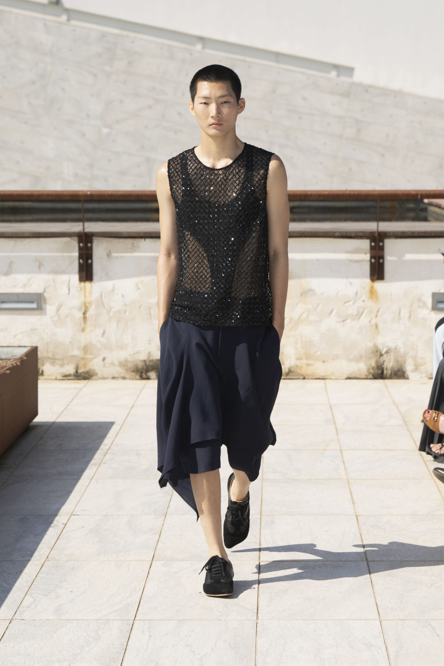 black mesh top with navy skirt
