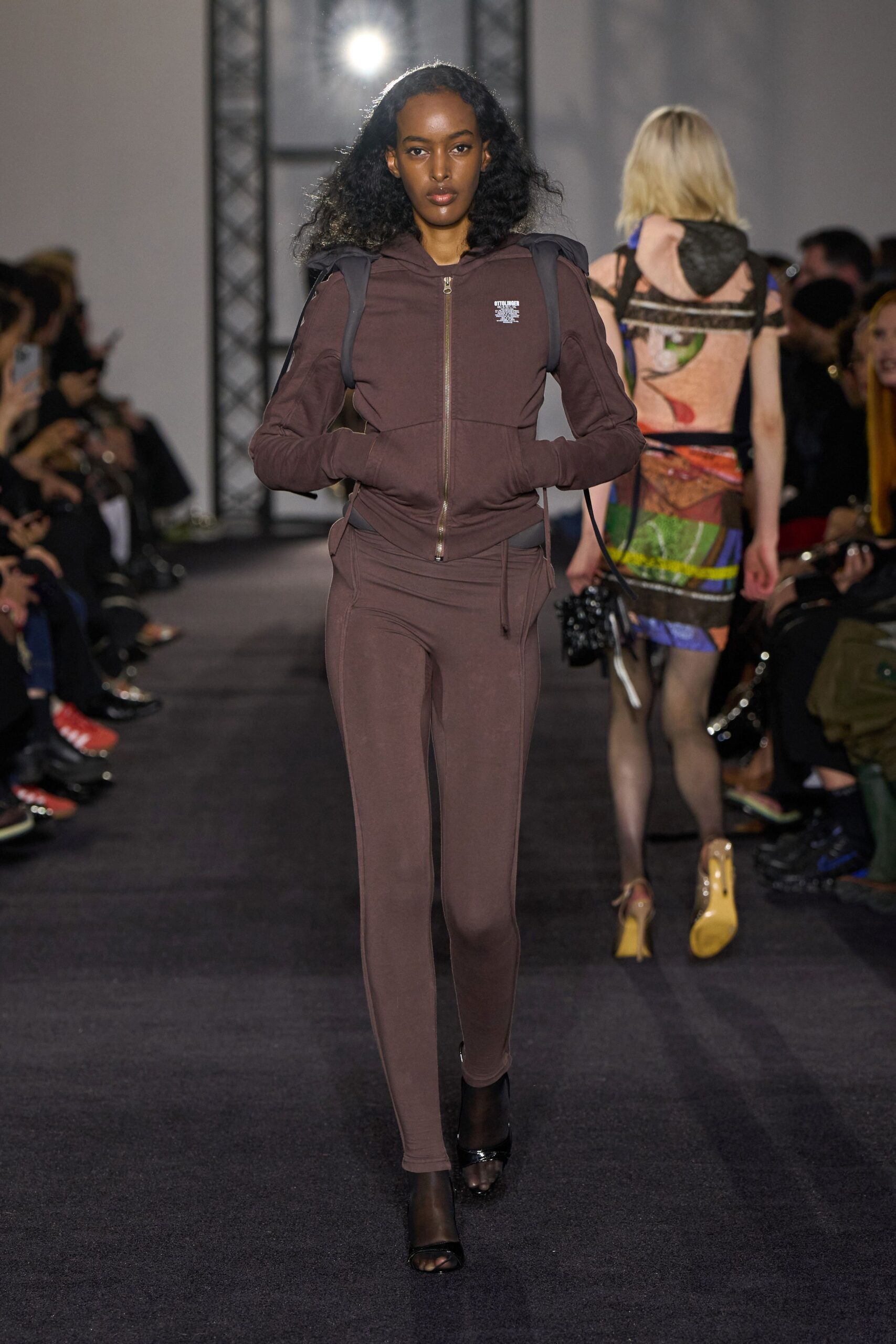 brown fitted jumpsuit with black shoes