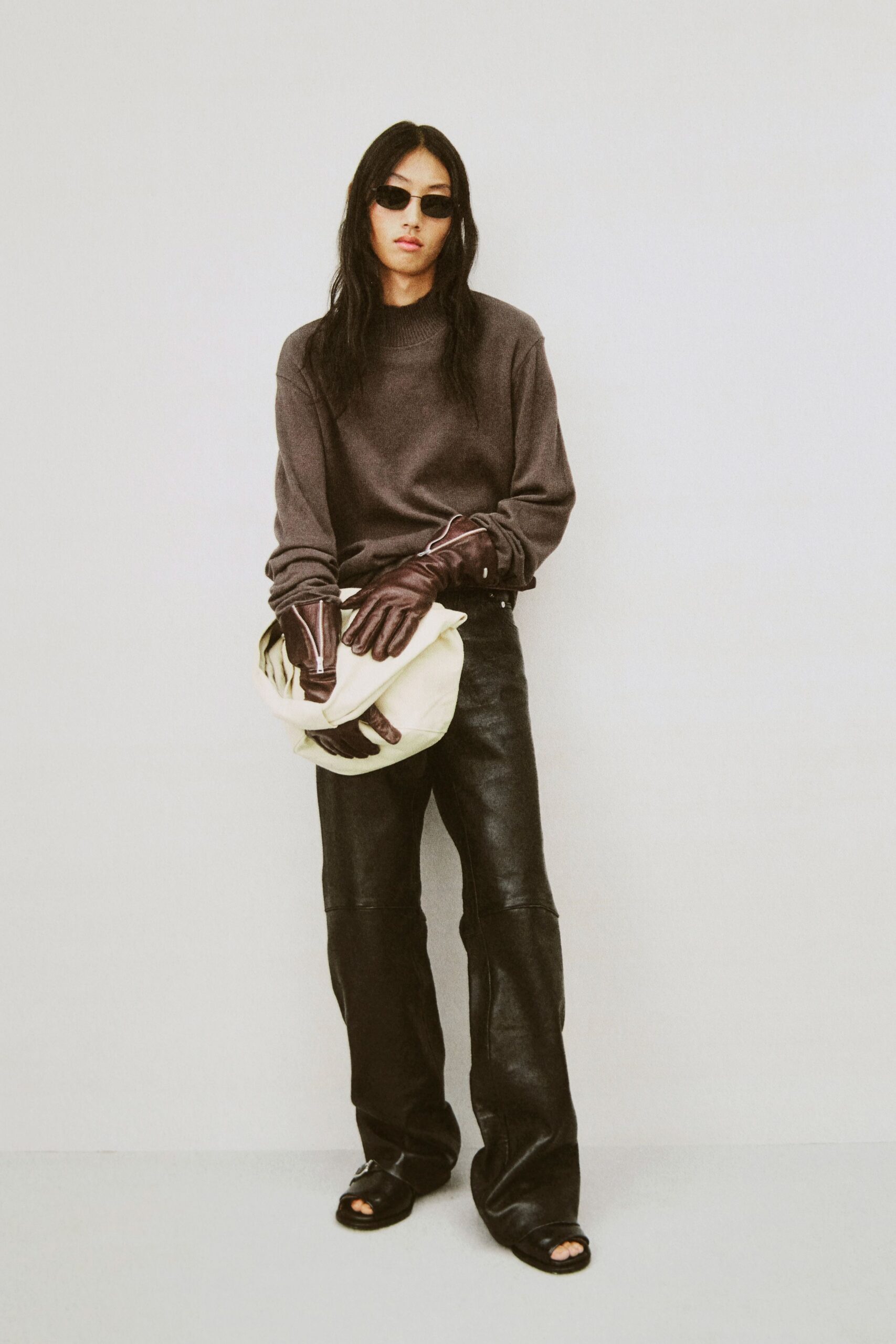 brown wool relaxed sweater with black leather pants