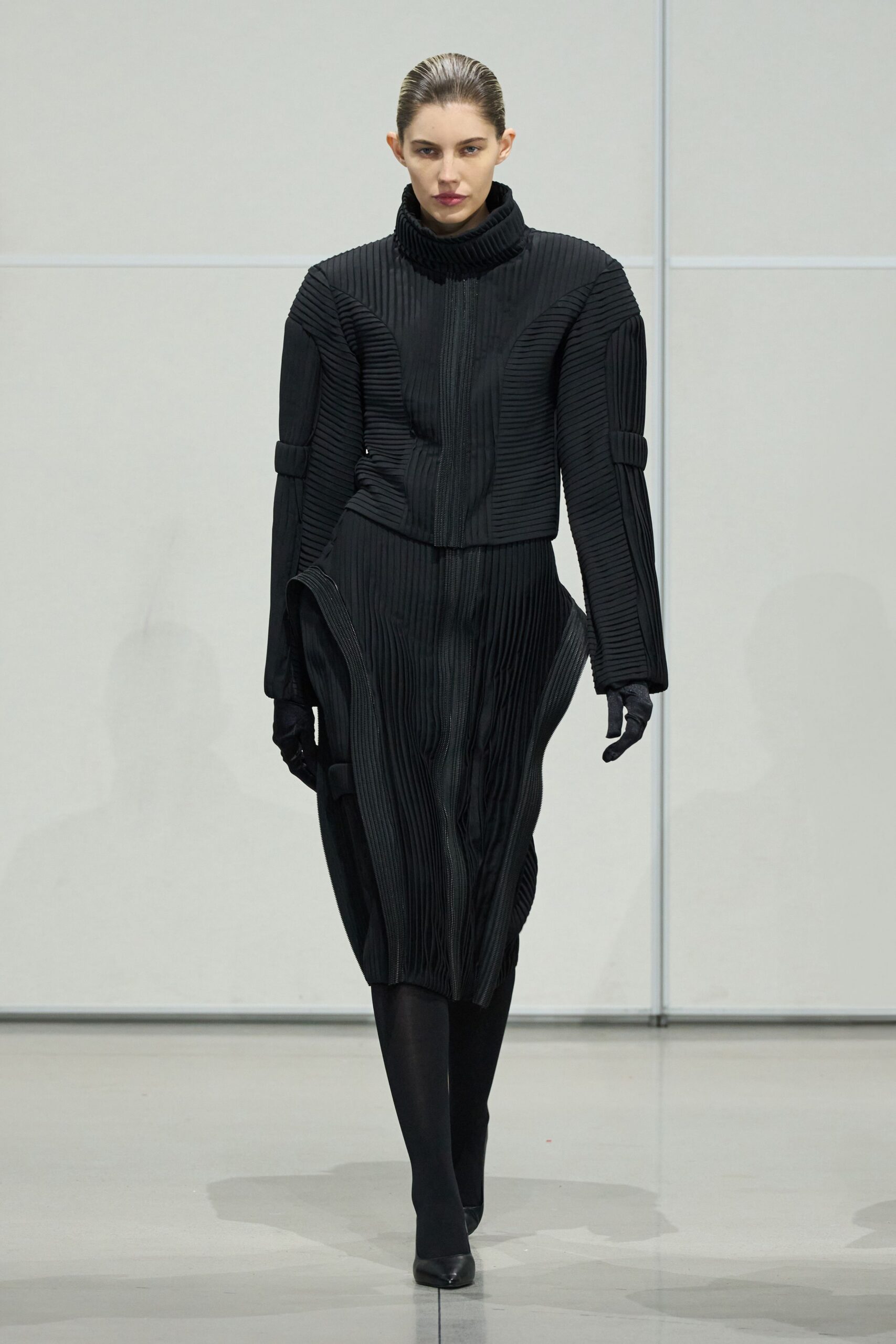 black pleated coat and dress
