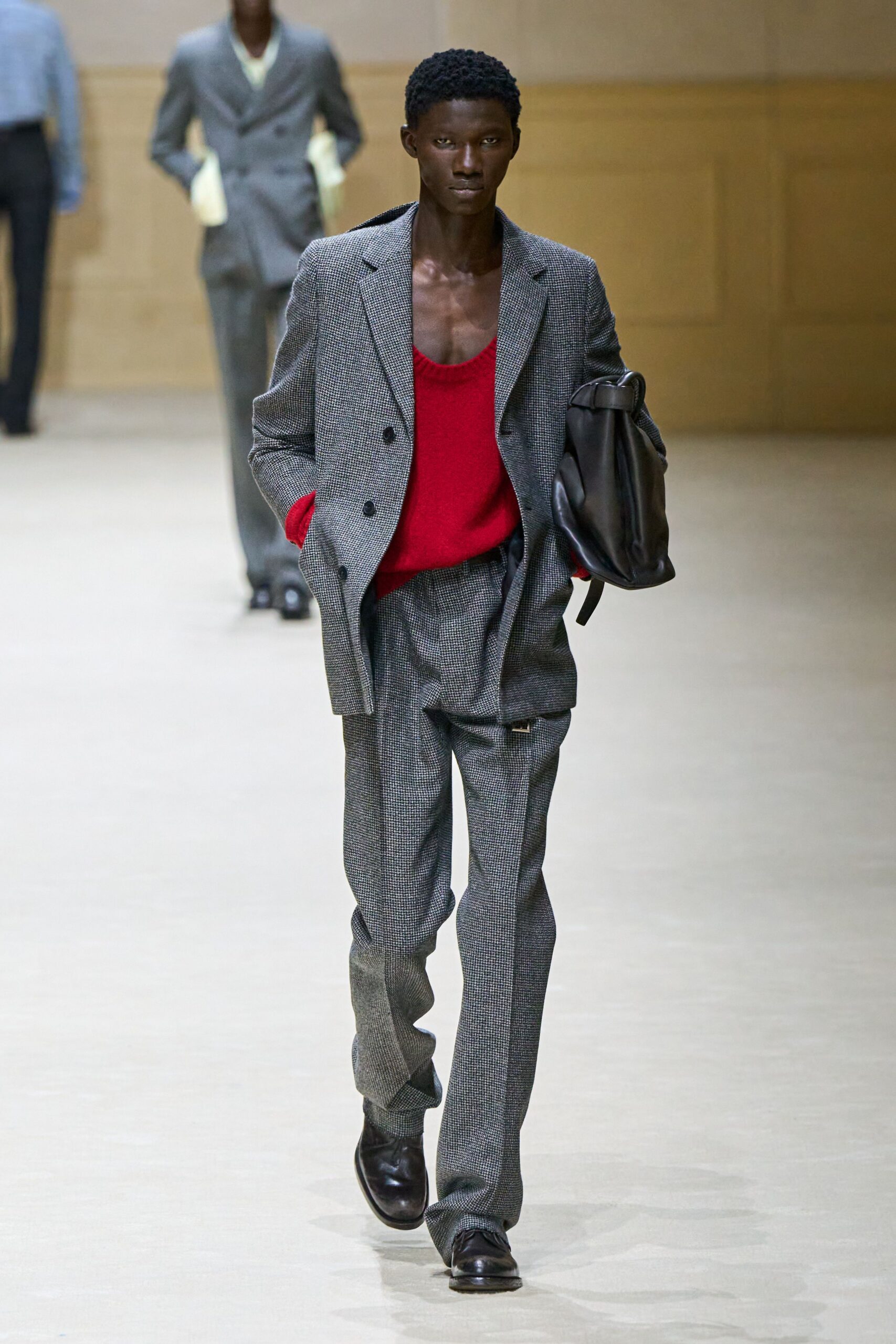 gray tailored suit with red top