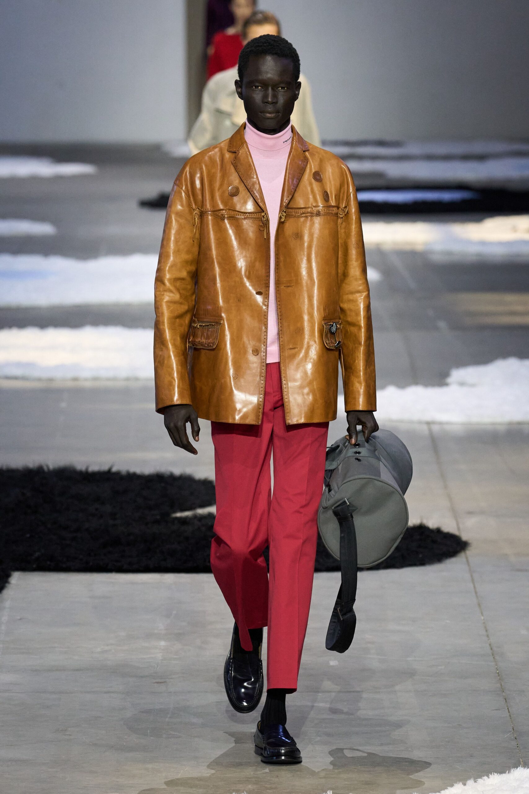 brown leather jacket with pink shirt