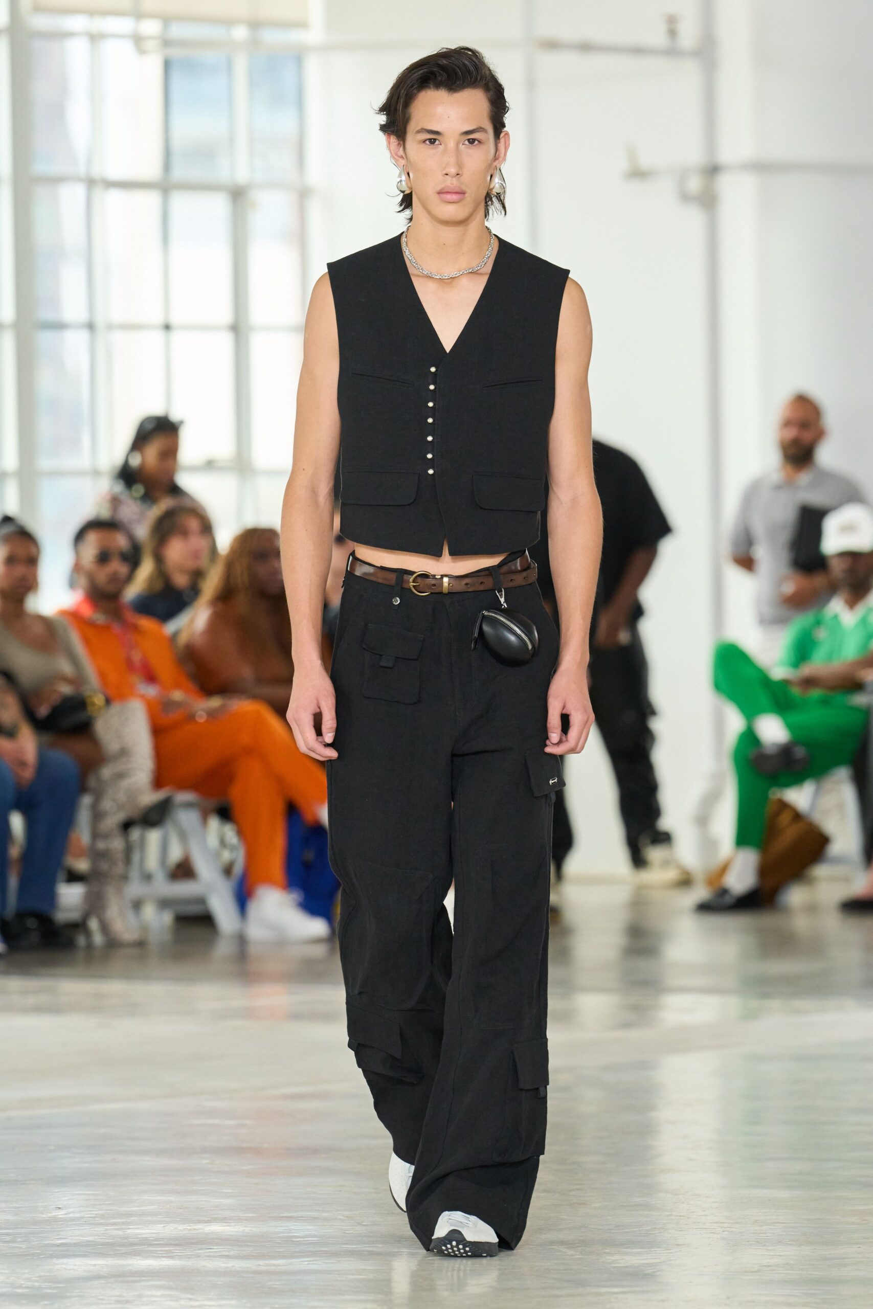 black fitted vest and relaxed pants