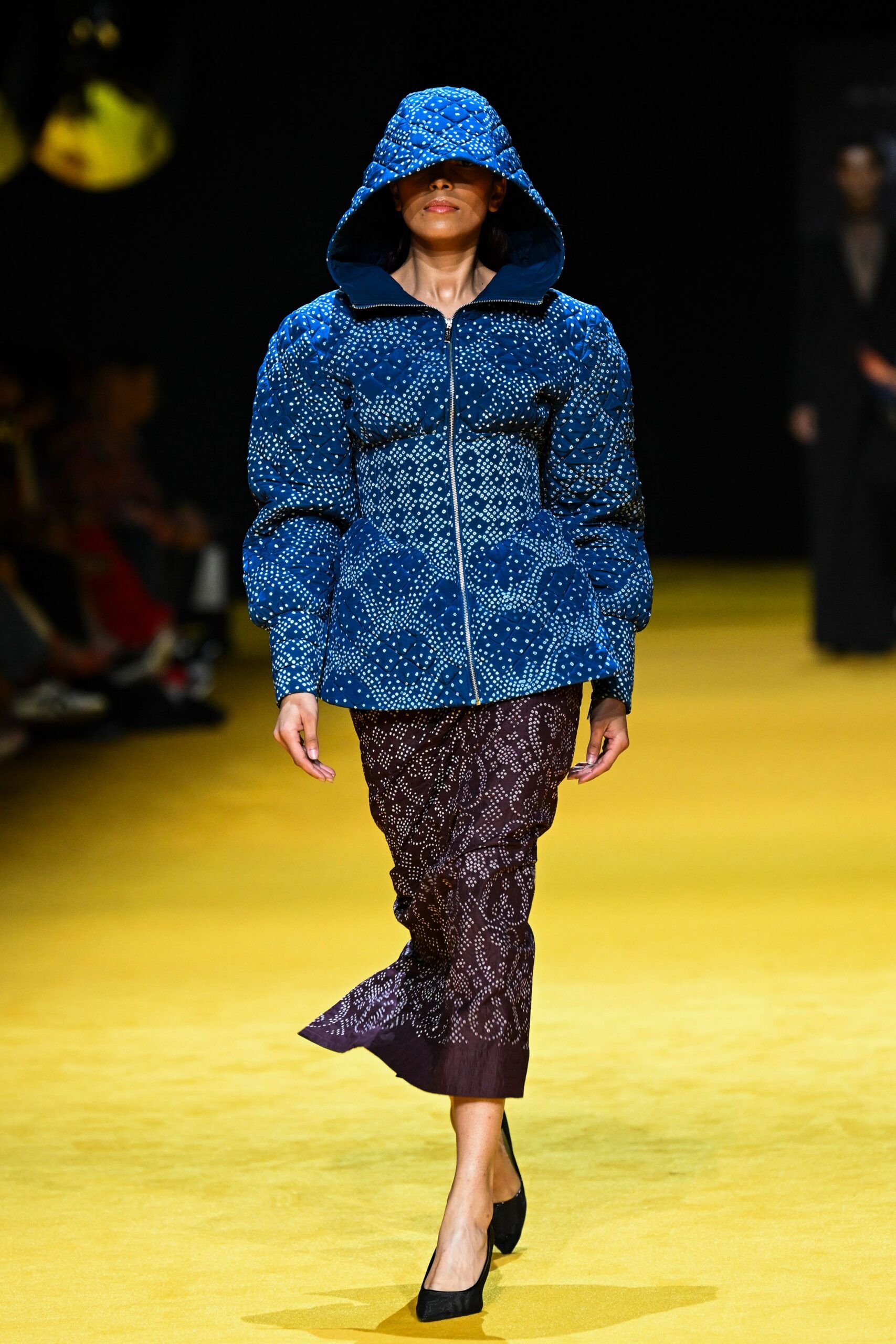blue padded jacket with brown skirt