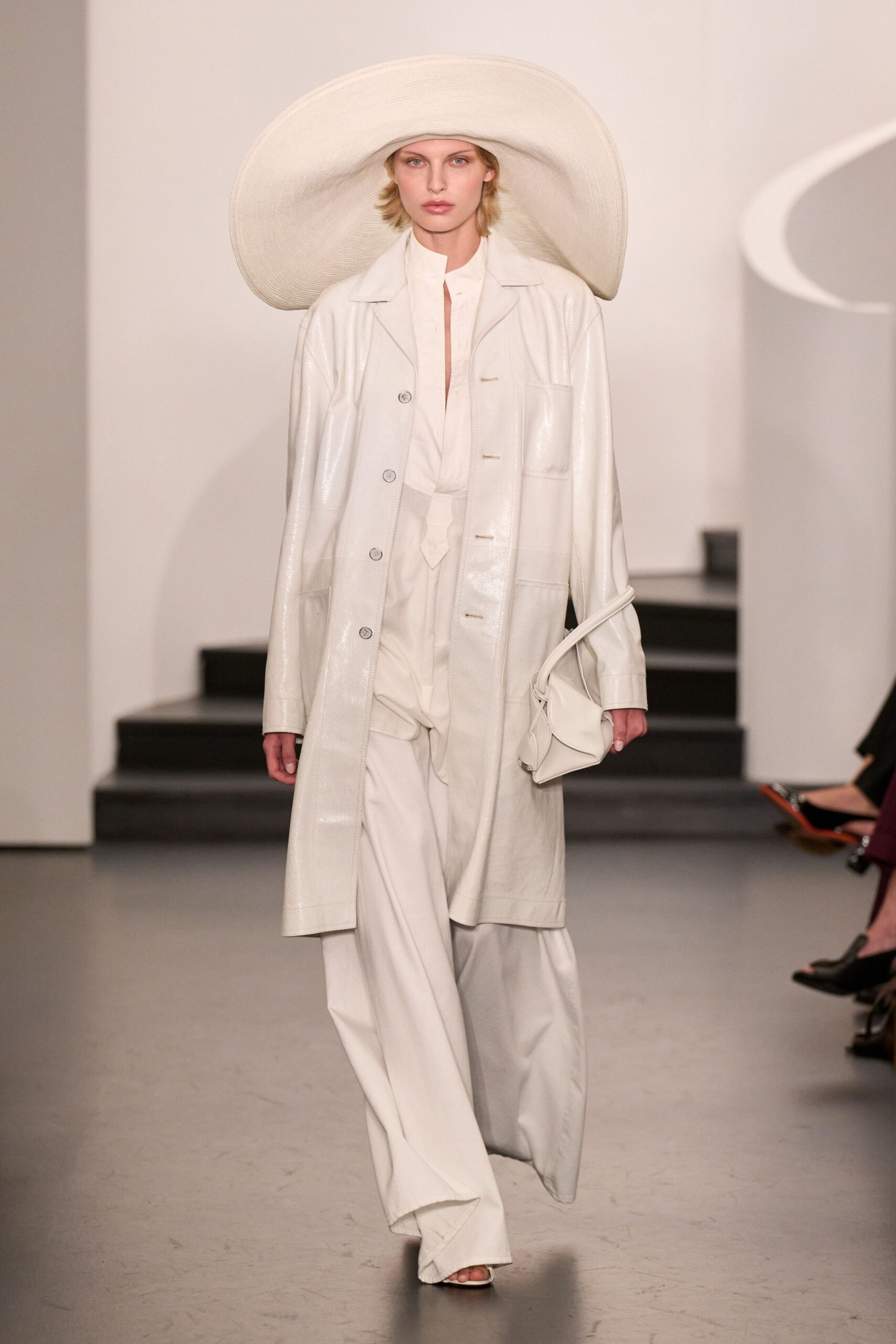 white vinyl long-sleeve collared relaxed buttoned shiny coat