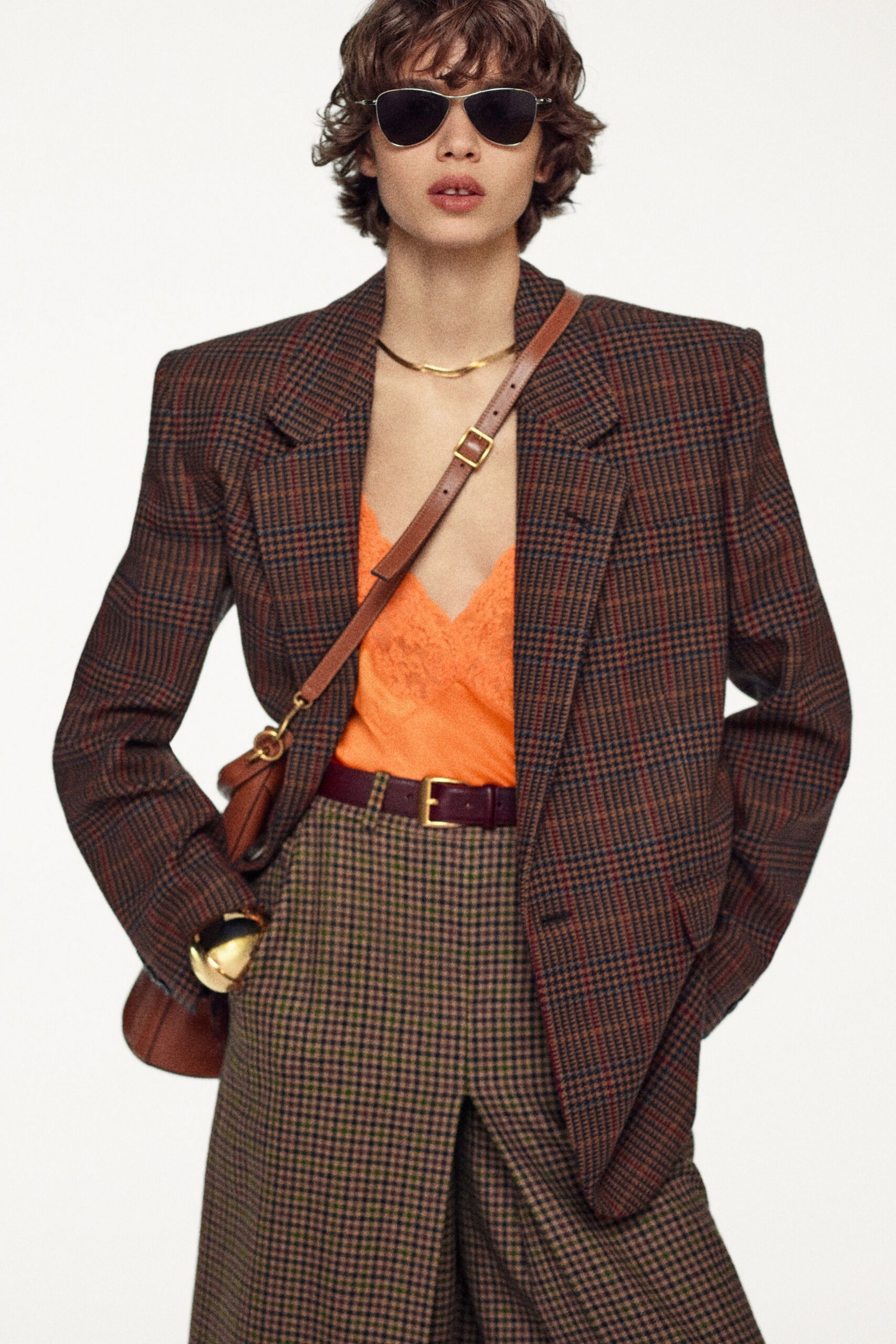 oversized brown checked blazer with orange top