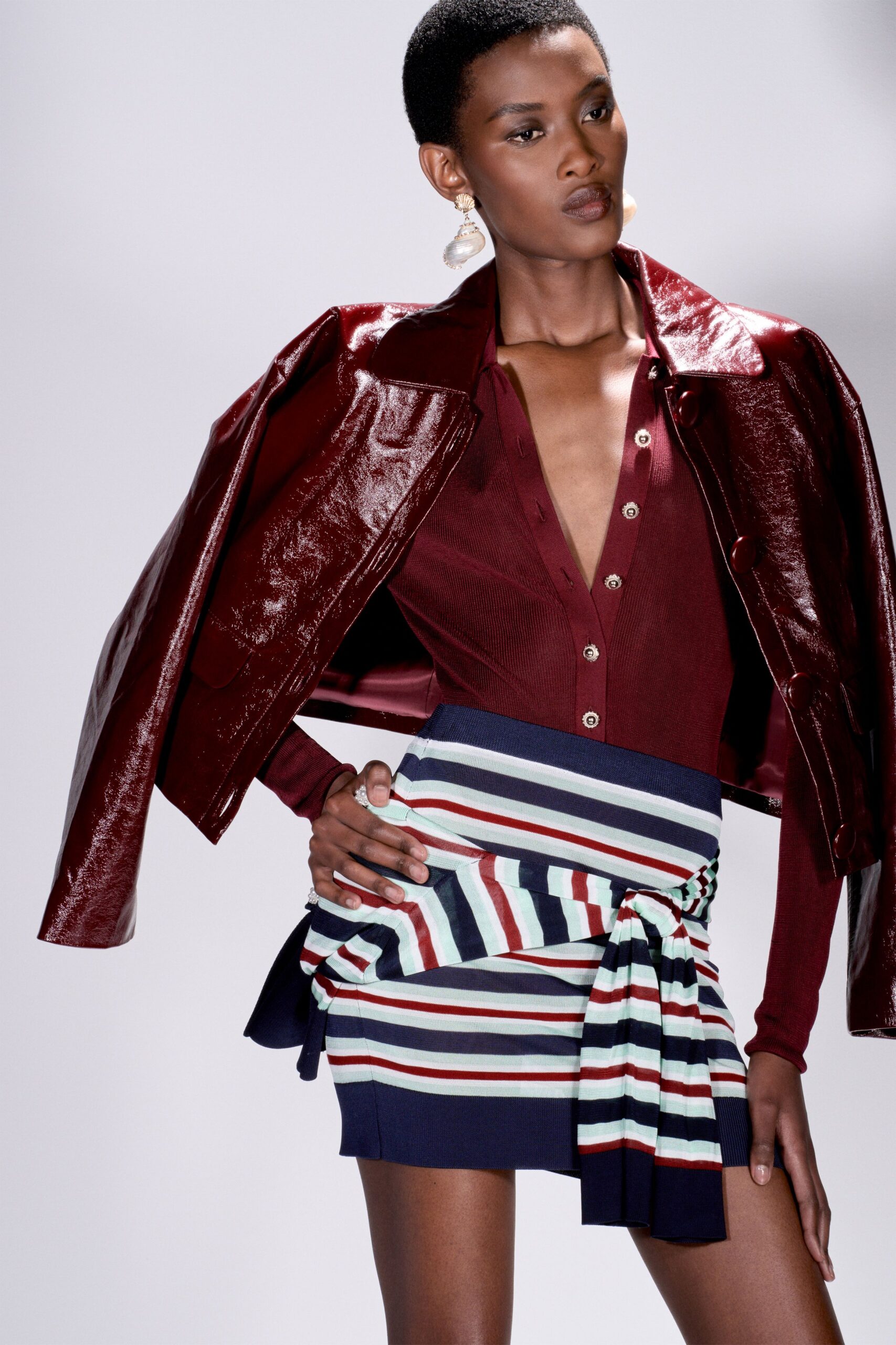 red vinyl long-sleeve collared fitted zippered shiny jacket