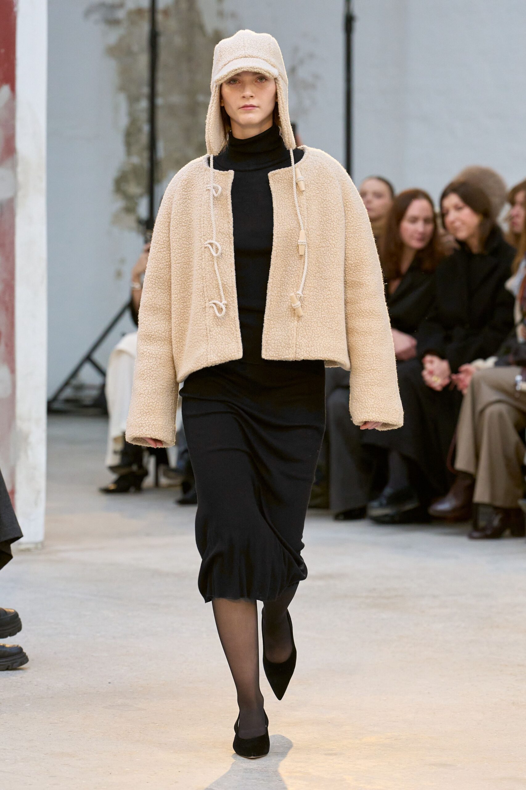 beige wool jacket black midi dress