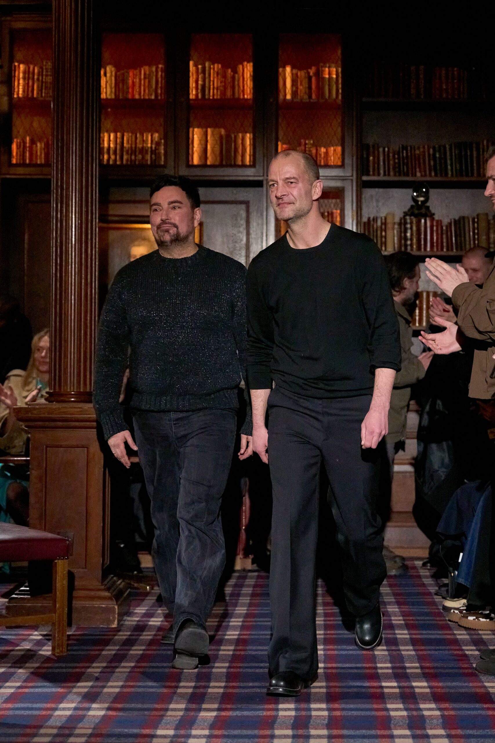 black relaxed sweater and fitted pants