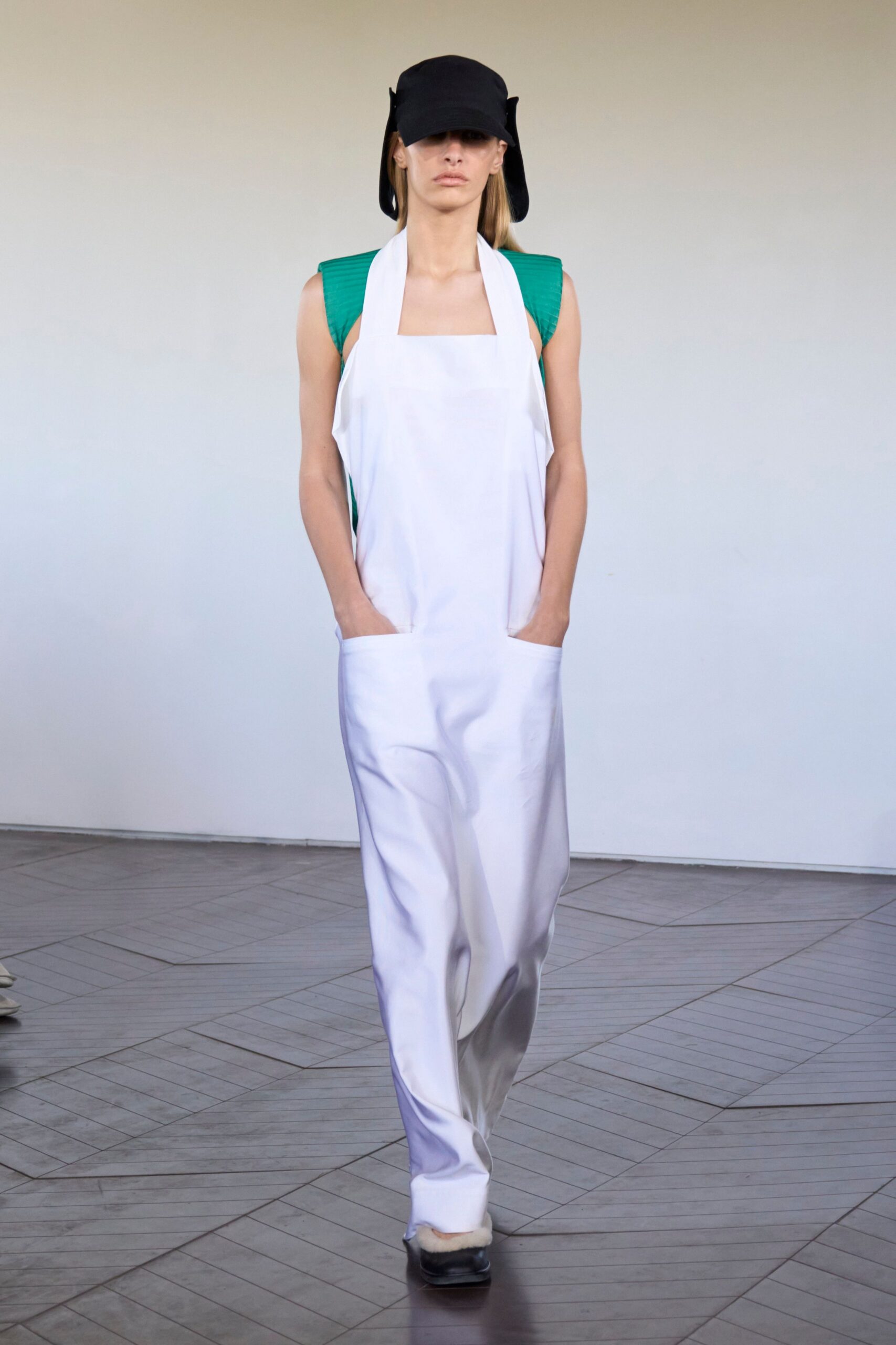 green cotton sleeveless fitted top