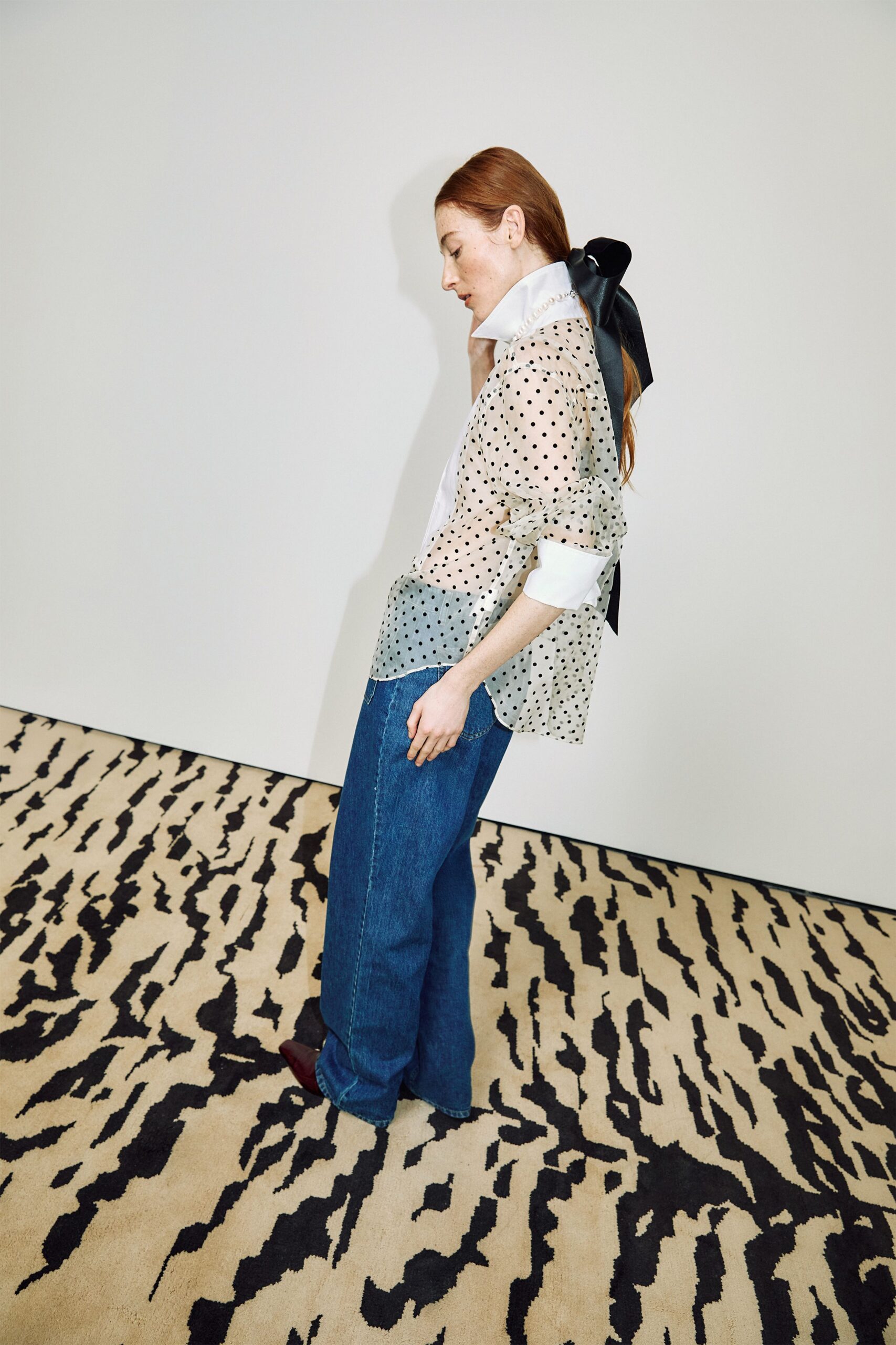 white polka-dot shirt with denim pants