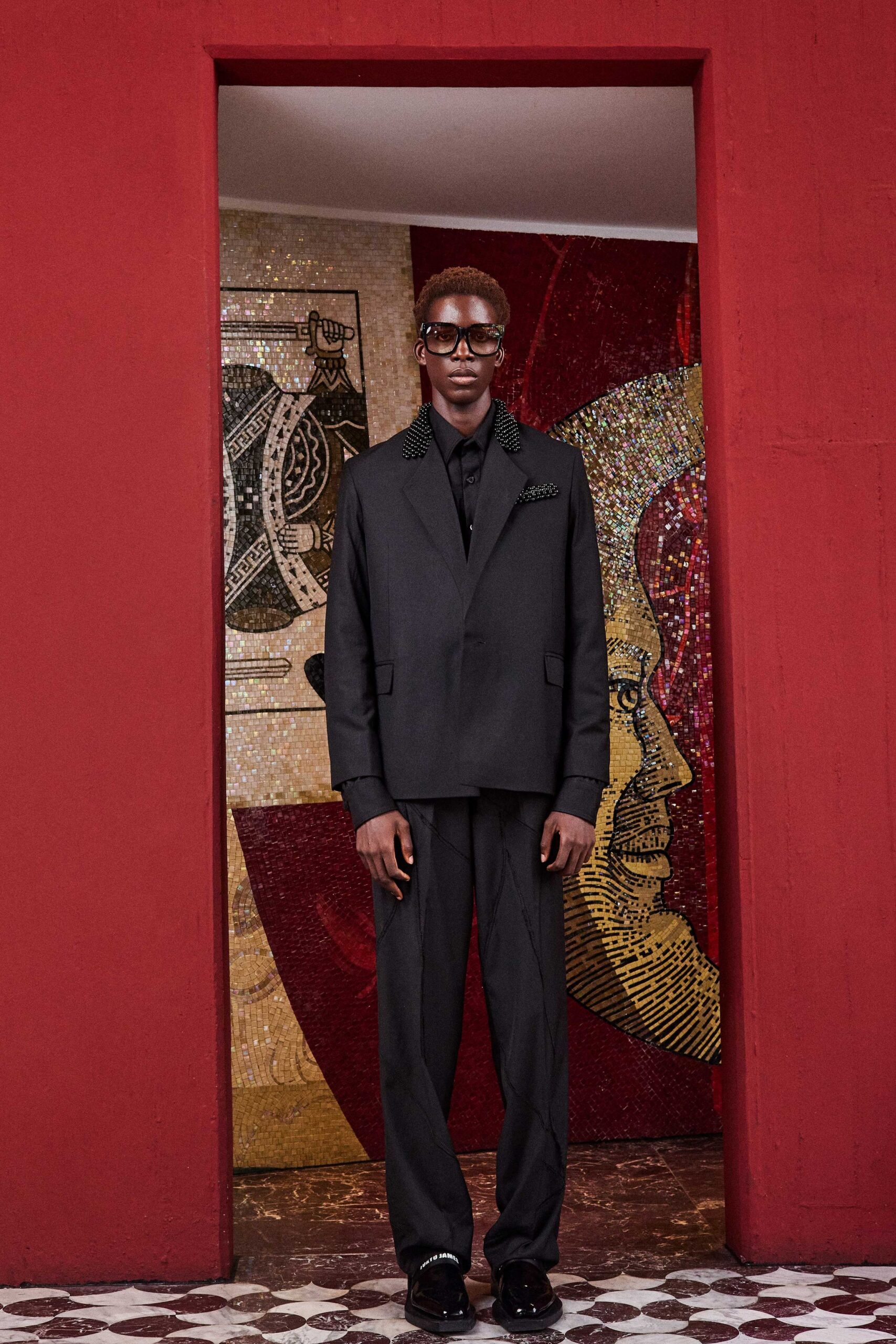 black tailored suit with sunglasses