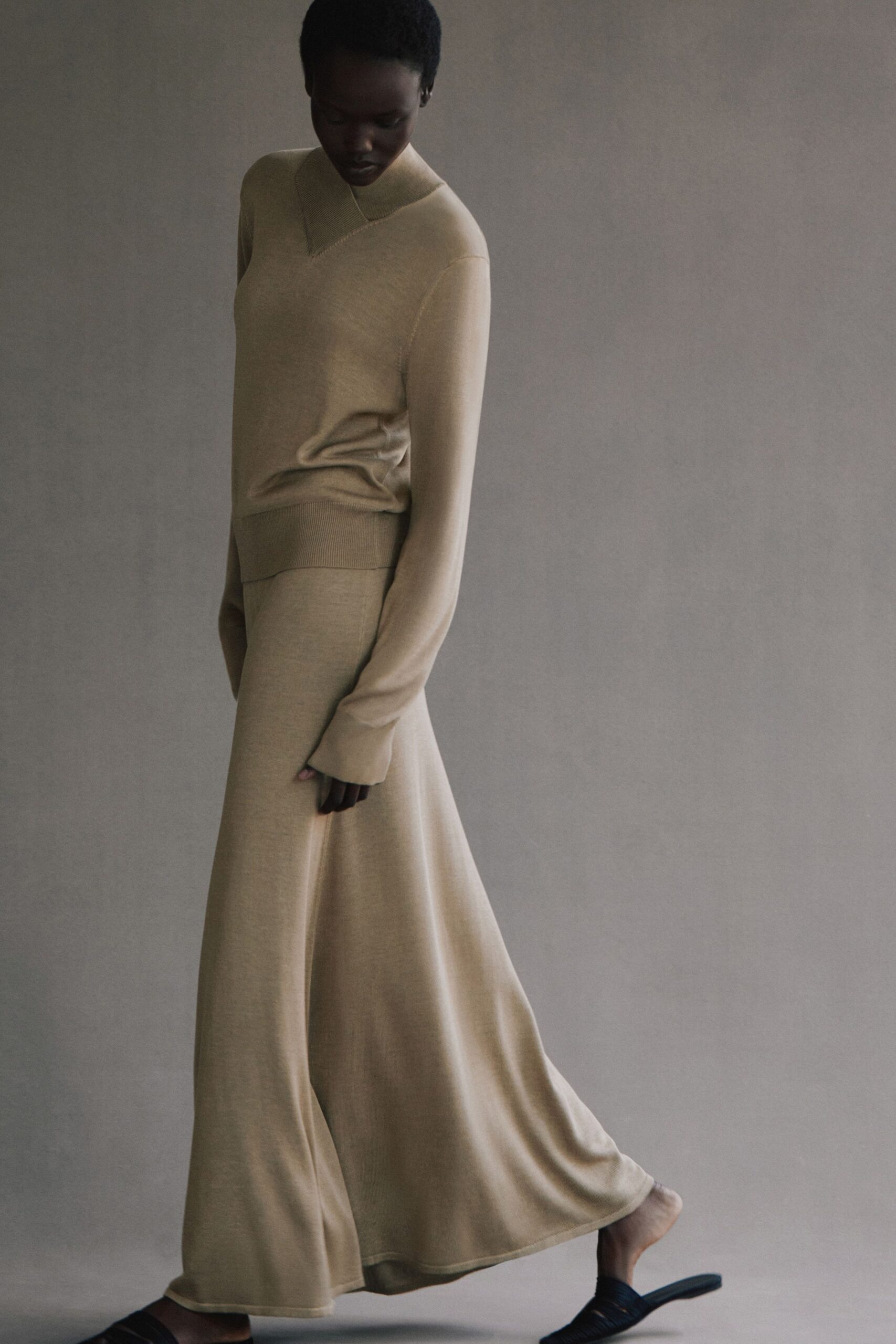 beige wool long-sleeve v-neck fitted layered flowing dress