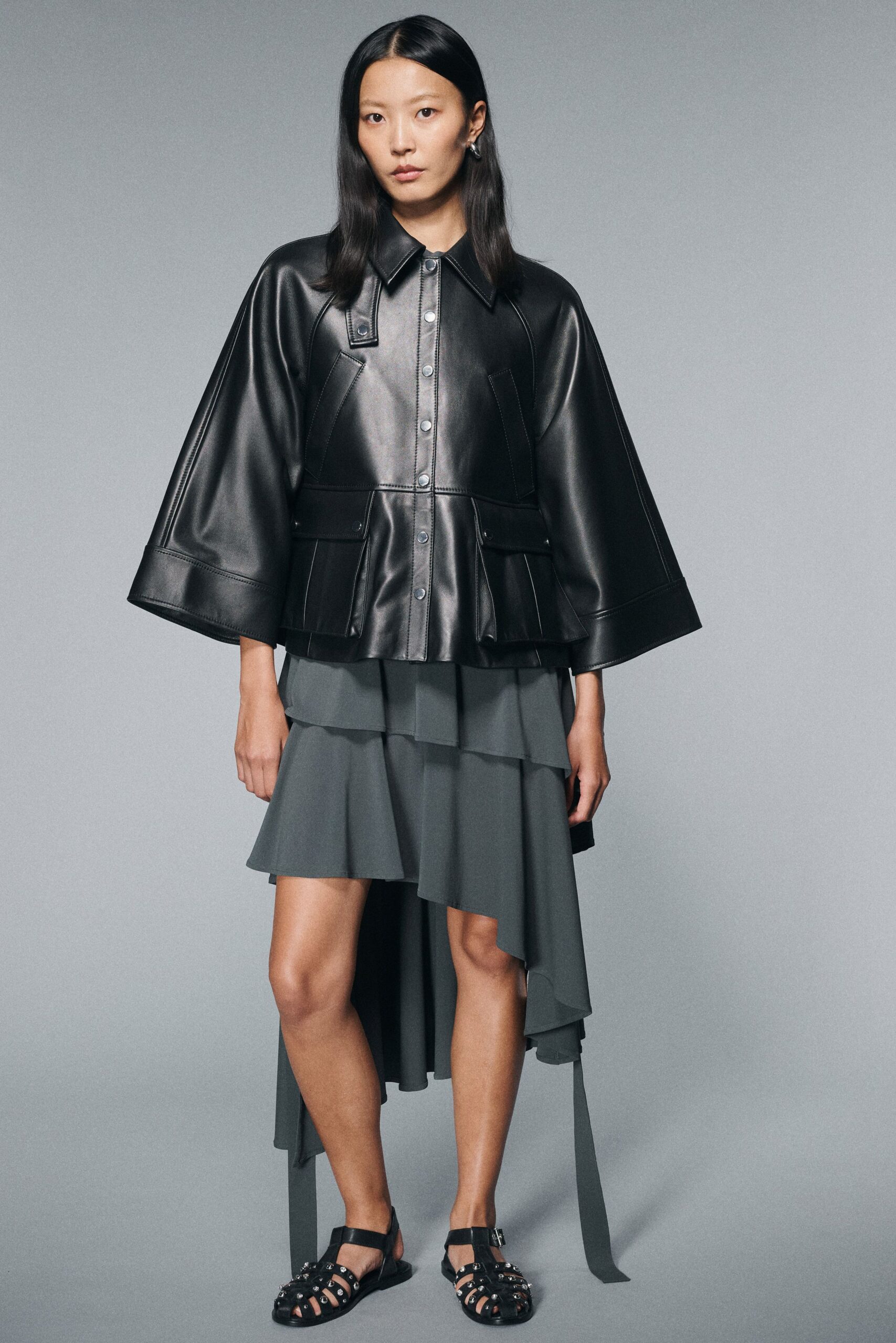 black leather long-sleeve collared structured buttoned jacket