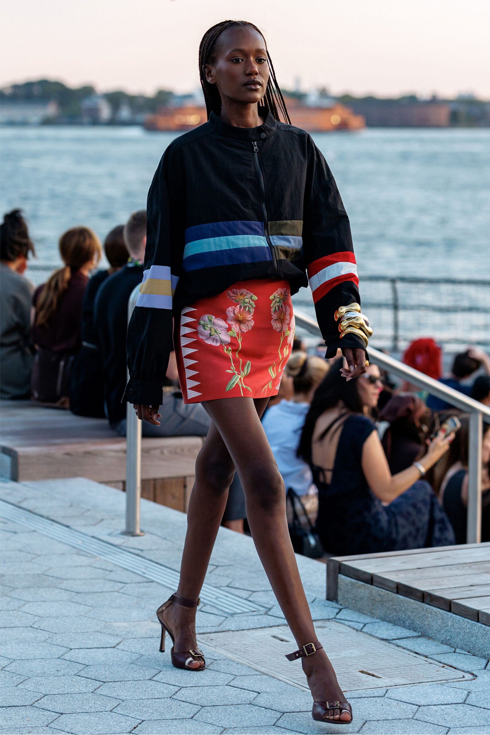 black color-blocked jacket with red mini skirt