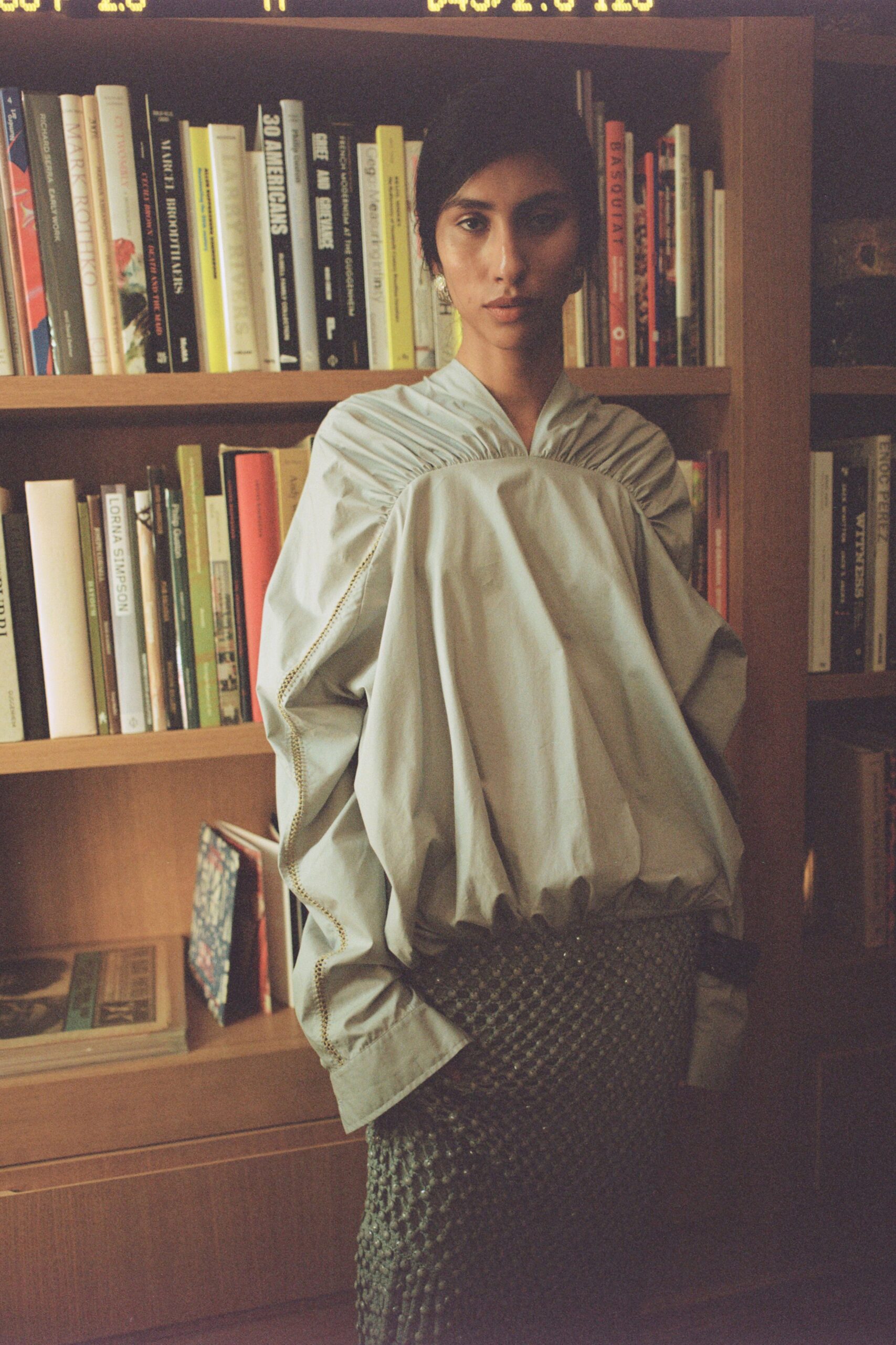 blue cotton long-sleeve collared oversized pleated top